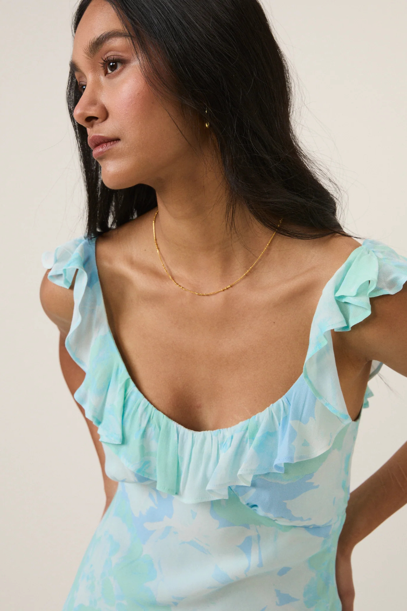 Woman wearing Nobody's Child Blue Floral Chiffon Logan Midi Dress by Nobody’s Child, shop the brand at Dotique.