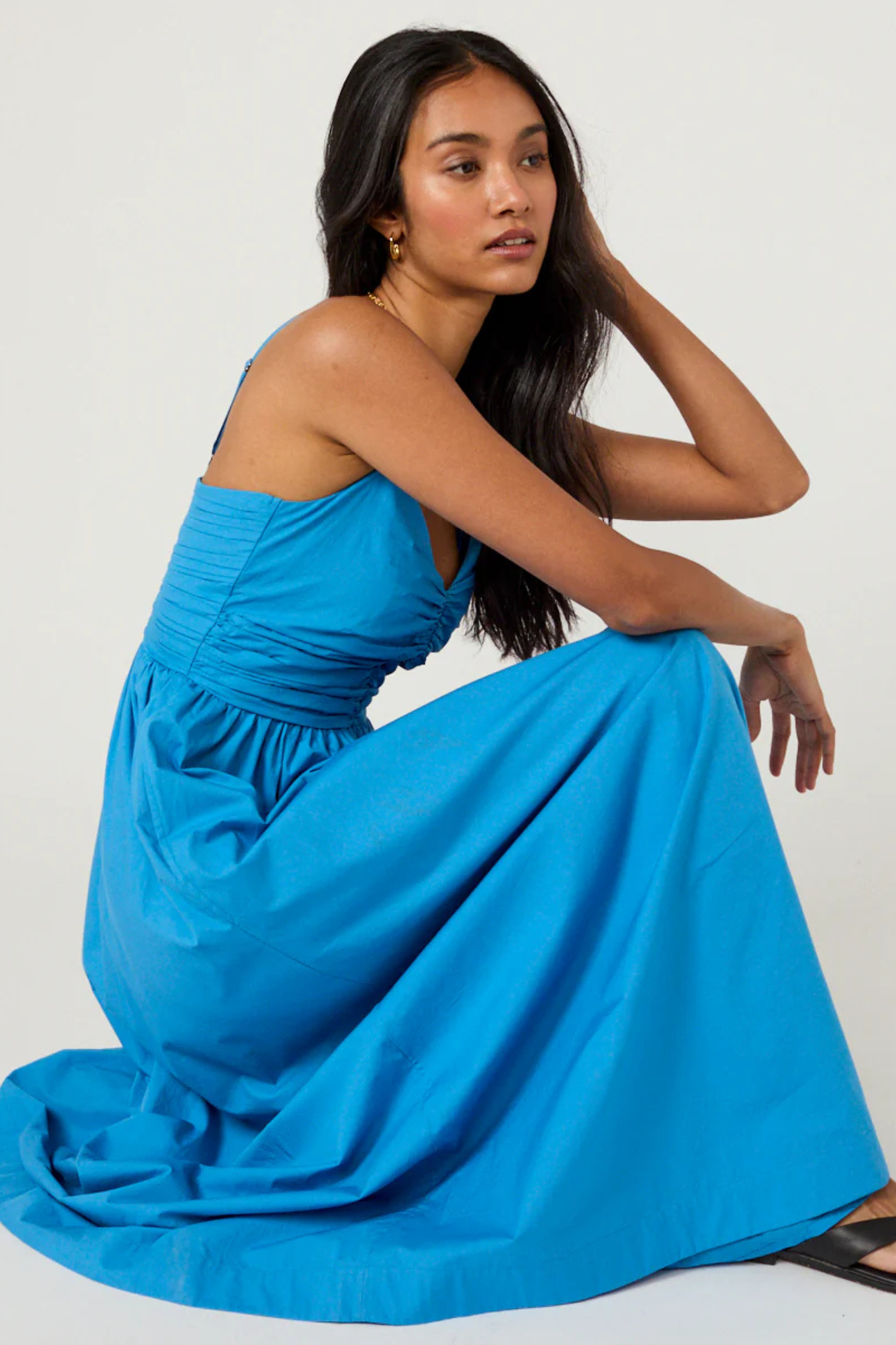 Woman wearing a blue Nobody's Child Paige Midi Dress by Nobody’s Child, shop the vendor at Dotique online store.