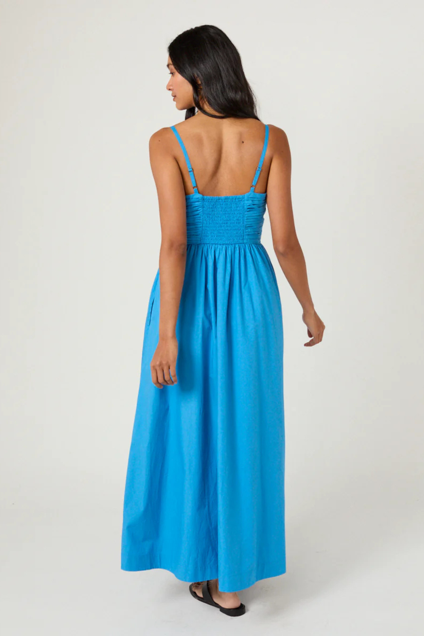 Woman wearing Nobody's Child Paige Midi Dress in blue by Nobody’s Child, shop the vendor at Dotique.