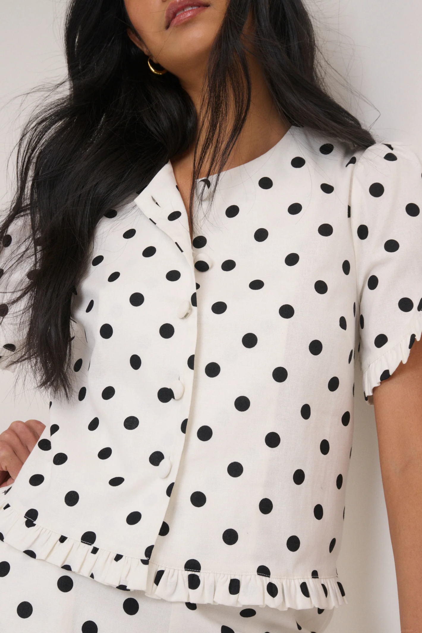 Woman wearing Nobody’s Child Ronne Frill Button Through Top Polka Dot by Nobody’s Child, shop the vendor at Dotique.