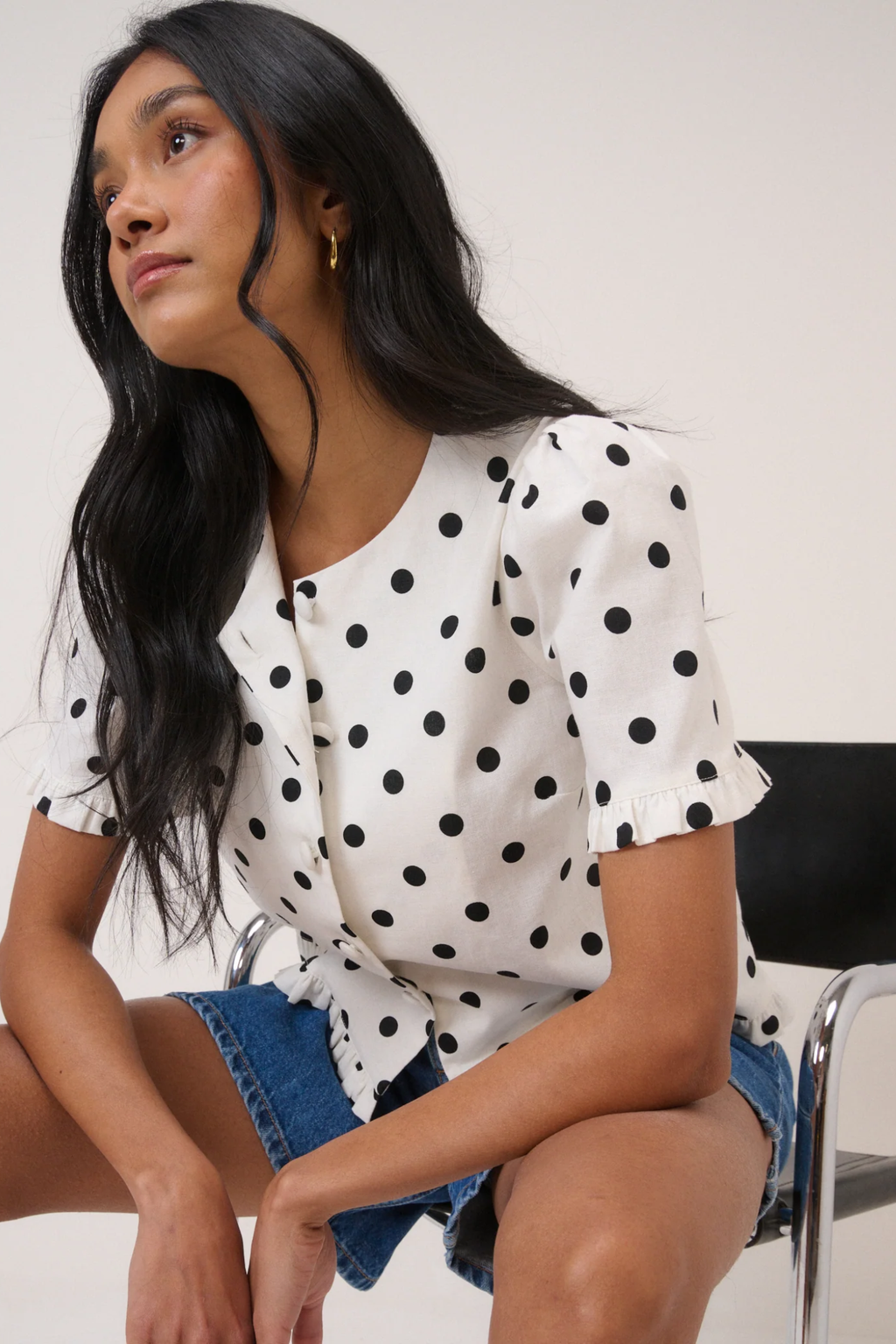 Model wearing Nobody’s Child Ronne Frill Button Through Top Polka Dot by Nobody’s Child, shop the brand at Dotique.