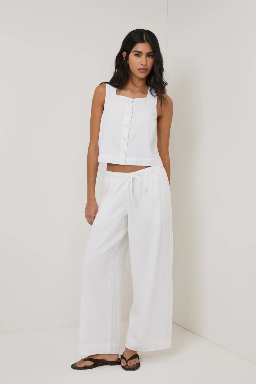 Model wearing Nobody's Child Sammie Linen Blend Button Front Tank Top White by Nobody’s Child shop at Dotique