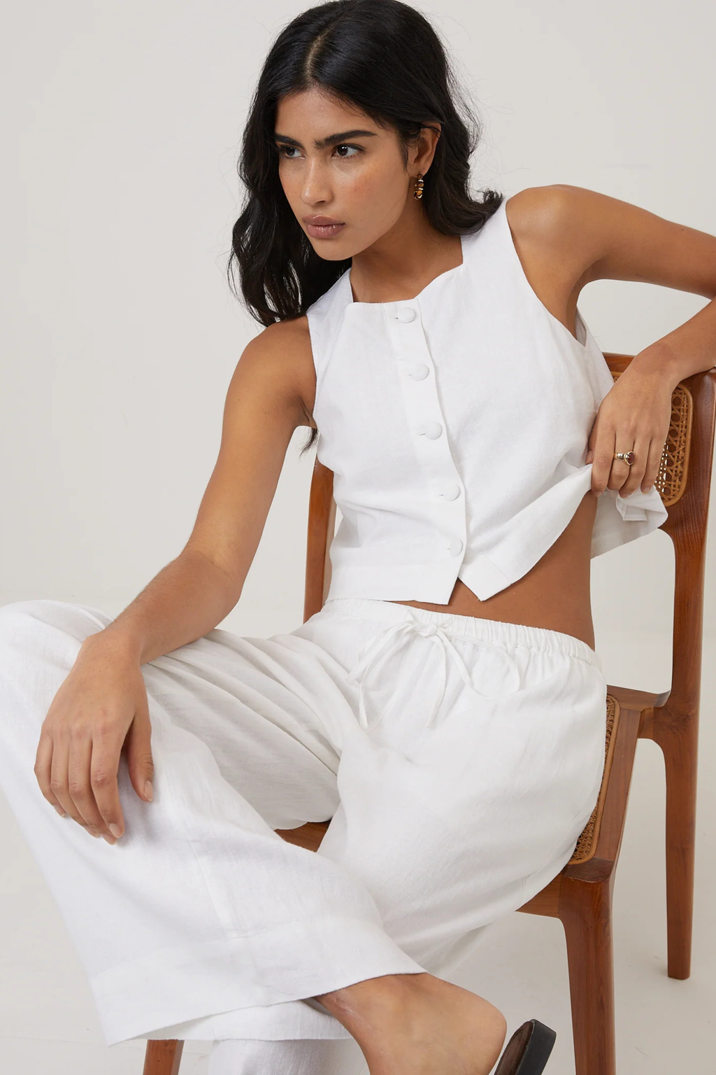 Model wearing Nobody's Child Sammie Linen Blend Button Front Tank Top White by Nobody’s Child shop Dotique for stylish summer looks