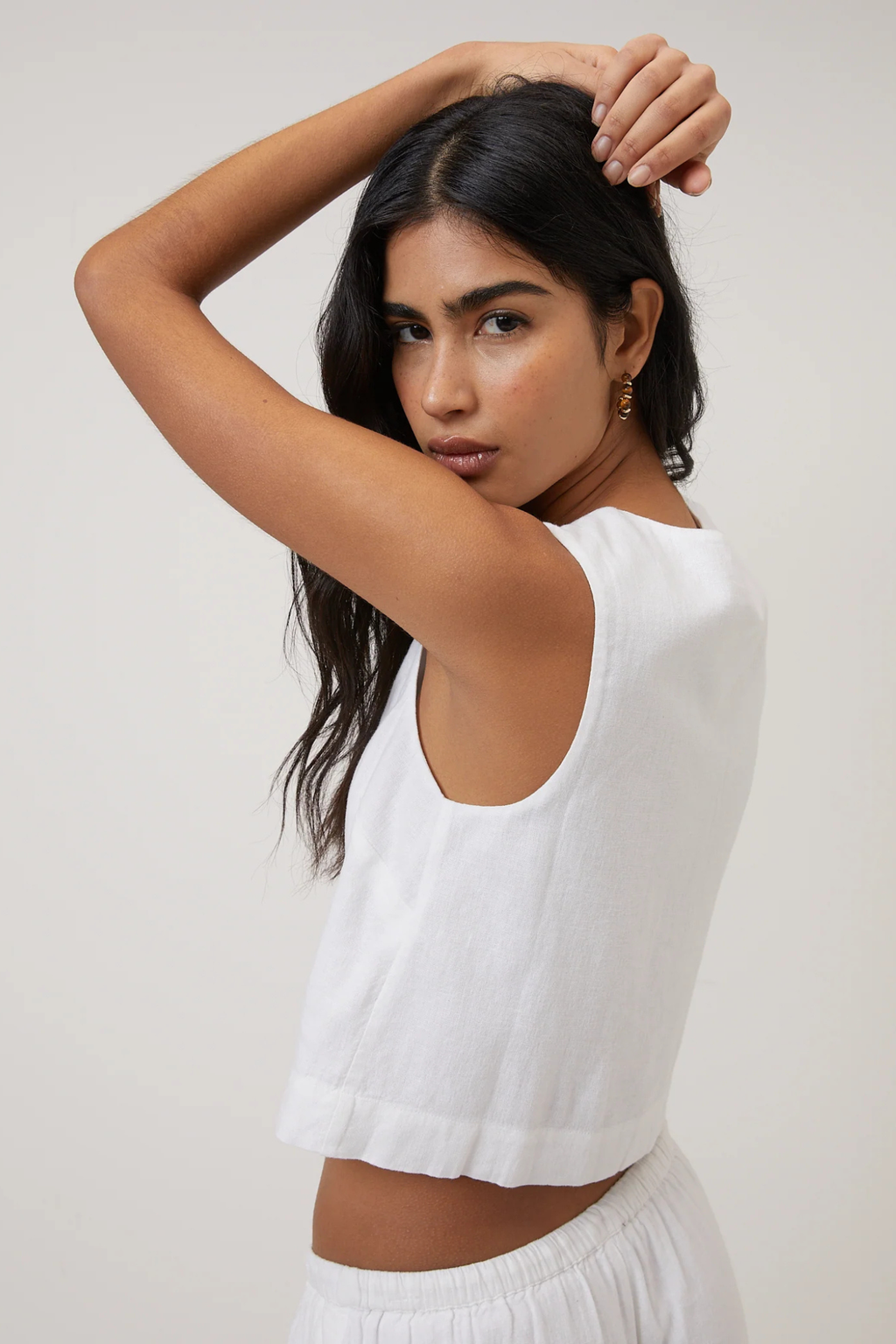 Woman wearing Nobody's Child Sammie Linen Blend Button Front Tank Top White by Nobody’s Child, shop Nobody’s Child at Dotique