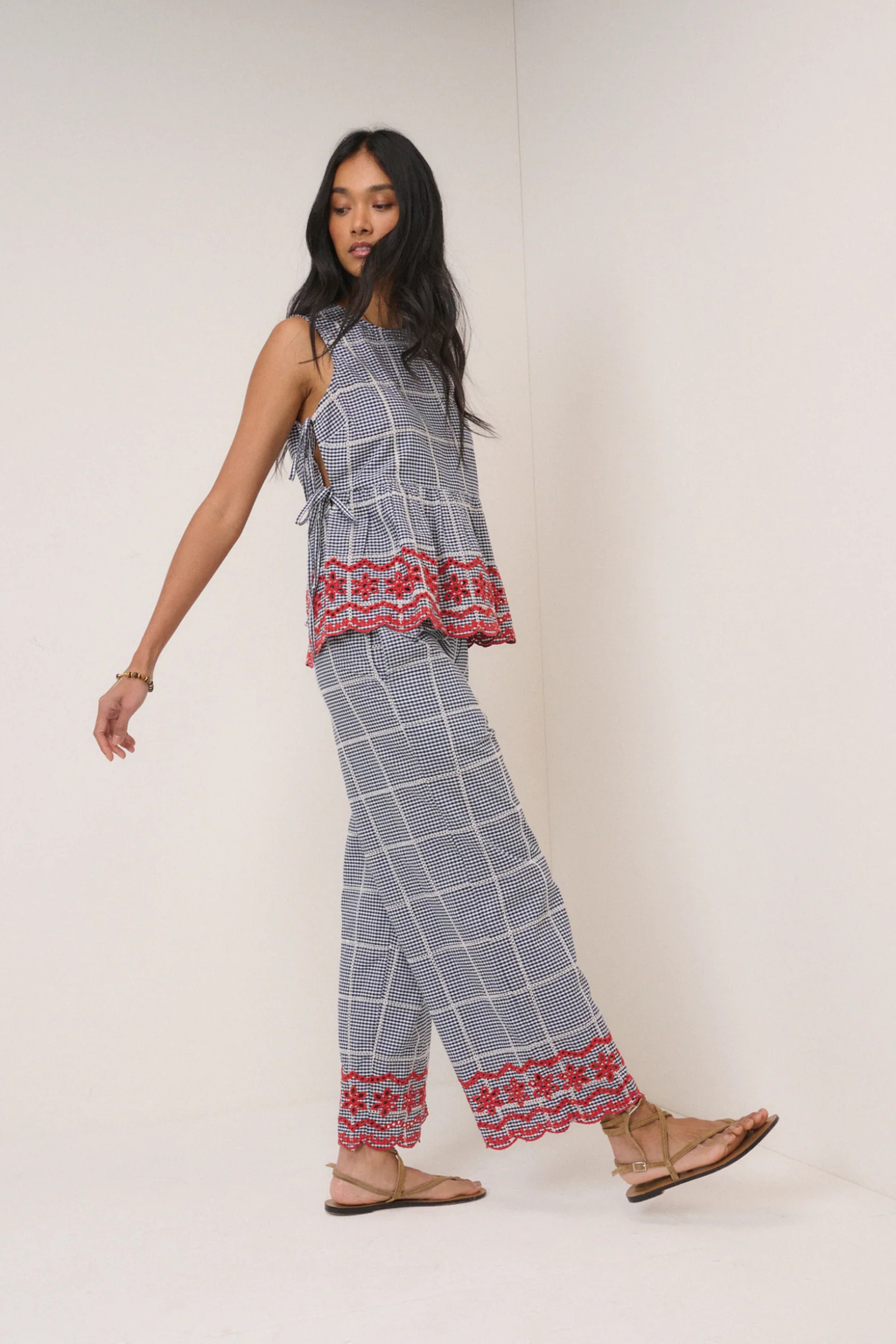 Model wearing Nobody's Child Shrew Embroidered Cropped Trousers Black Gingham by Nobody’s Child. Shop Nobody’s Child at Dotique.