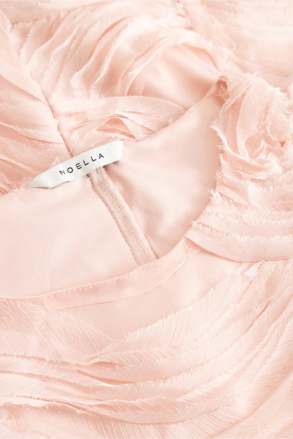 Close-up of soft textured fabric in baby pink showing the Noella 15430001 N-Michaela Dress Baby Pink by Noella, shop Noella at Dotique