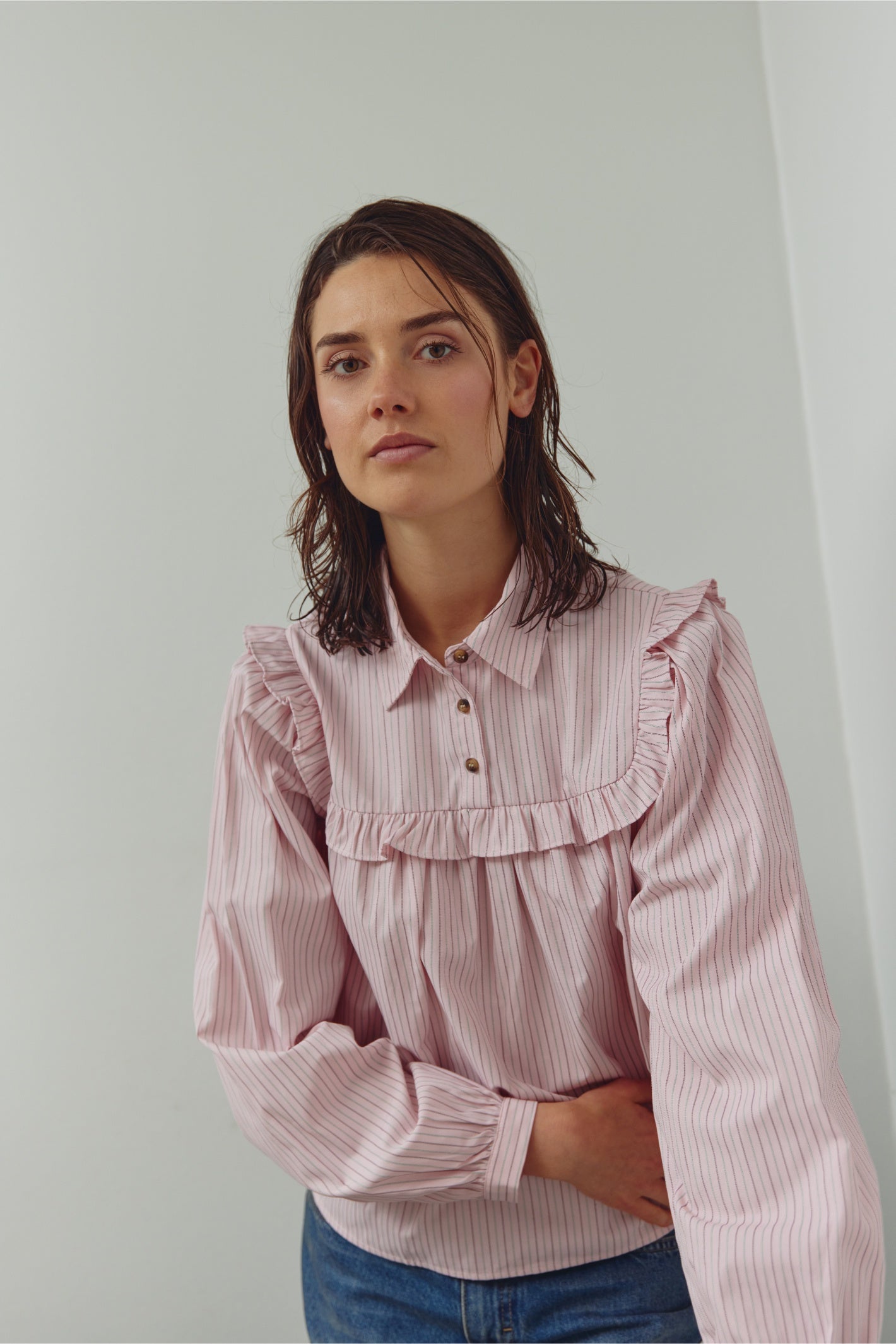 Model wearing Noella 15360001 N-Mikayla Blouse Donnie Blush Stripe by noella shop noella at Dotique in soft striped pink design