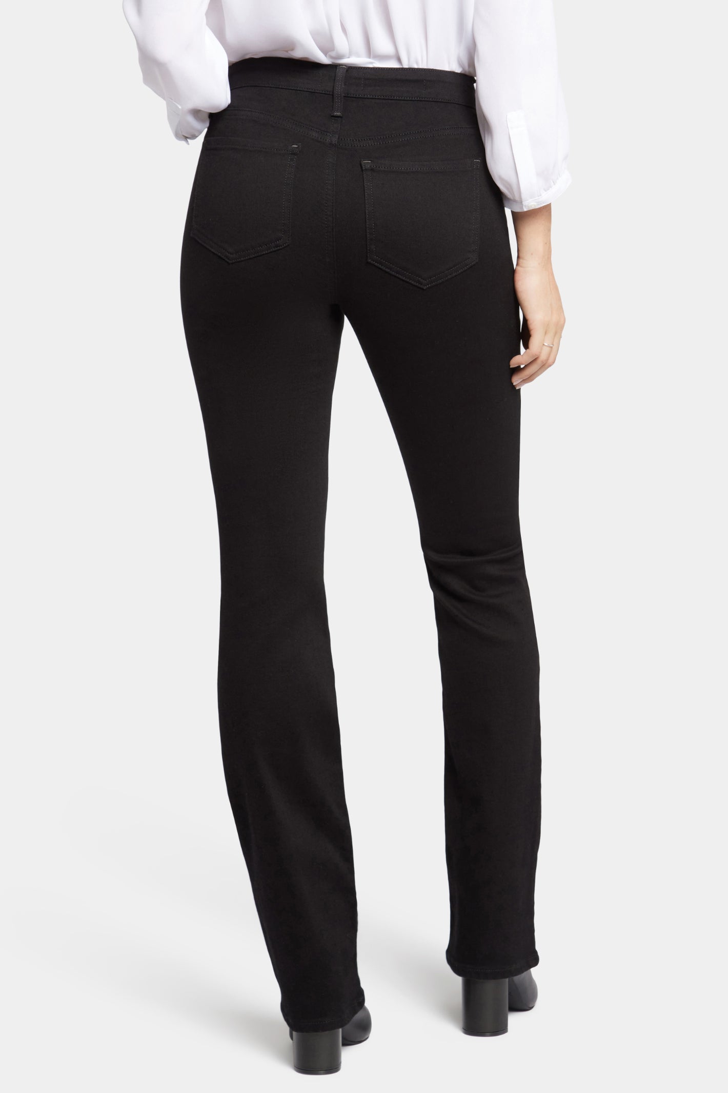Woman wearing NYDJ Barbara Bootcut Black Jeans 30” from NYDJ, shop the NYDJ collection at Dotique online store.