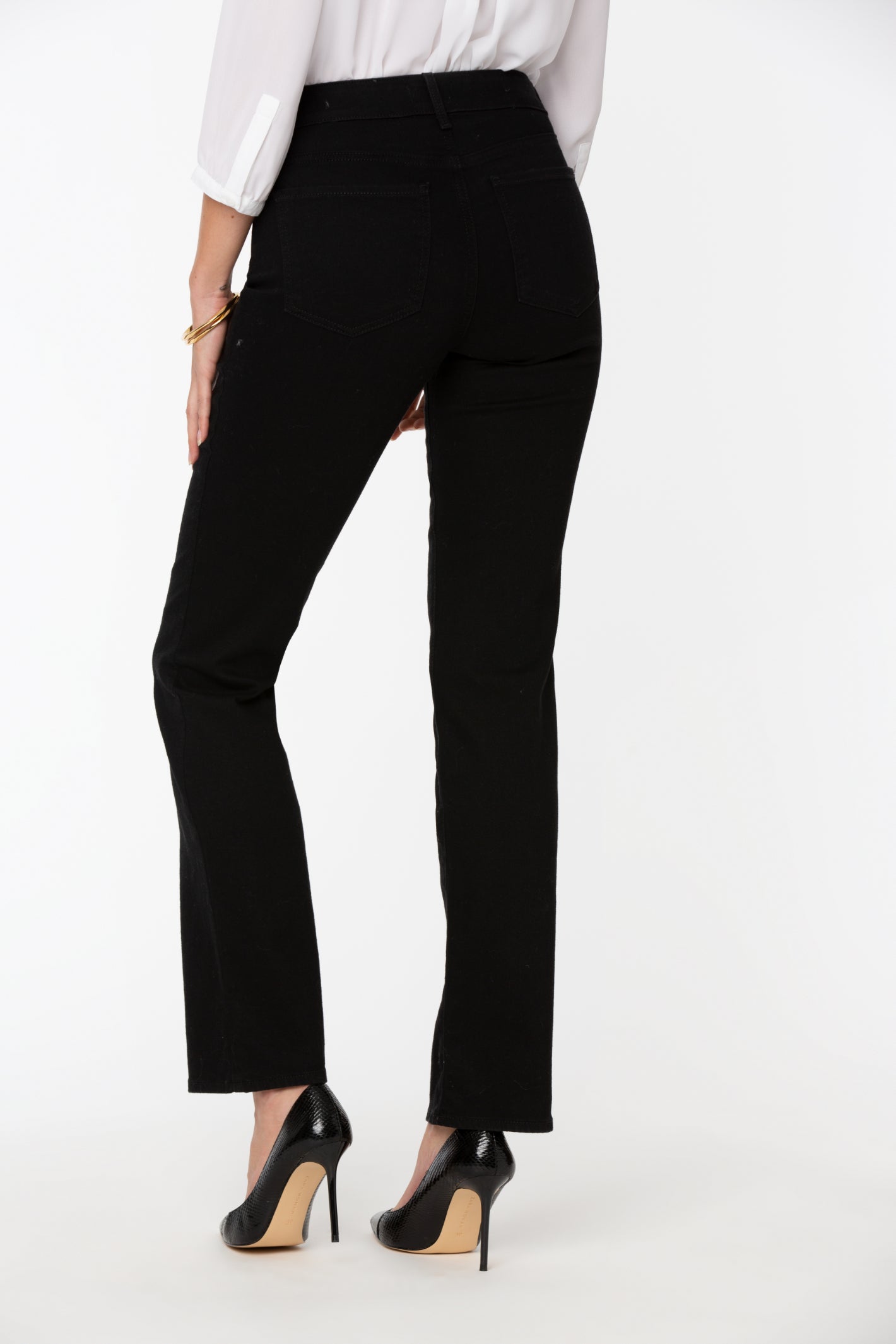 Model wearing NYDJ Barbara Bootcut Black Jeans 30” by NYDJ, shop the NYDJ collection at Dotique online store.