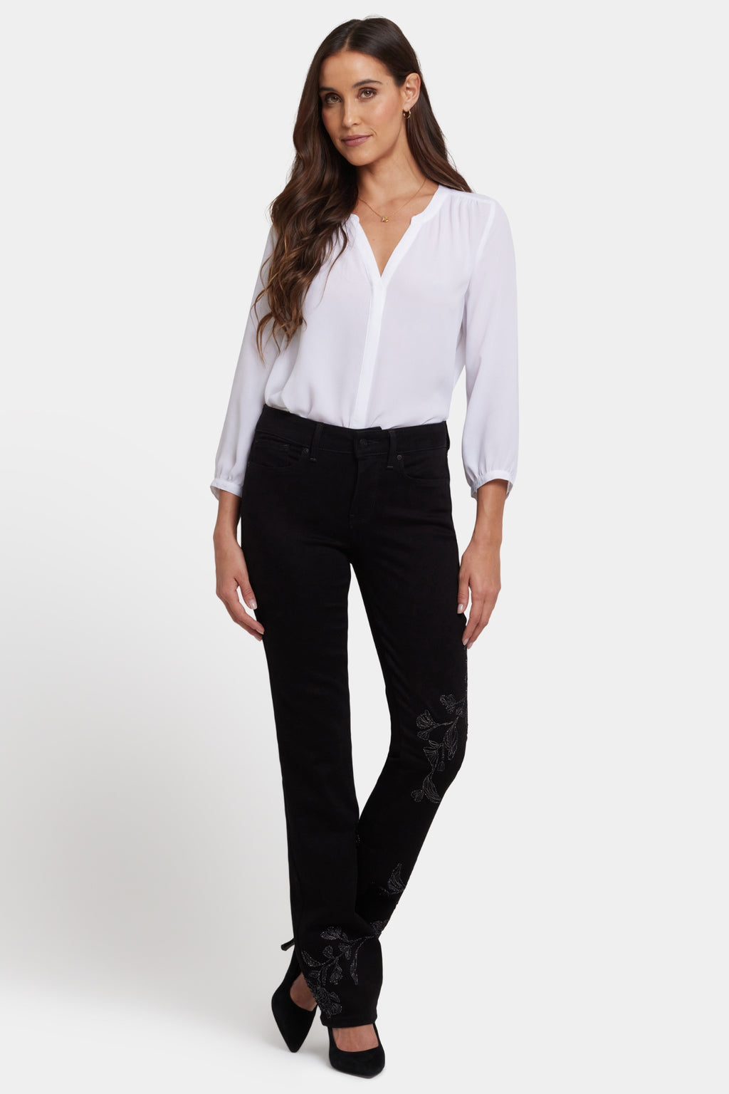 Woman wearing NYDJ Marilyn Straight Black Jeans 32” styled with a white blouse, shop NYDJ at Dotique.