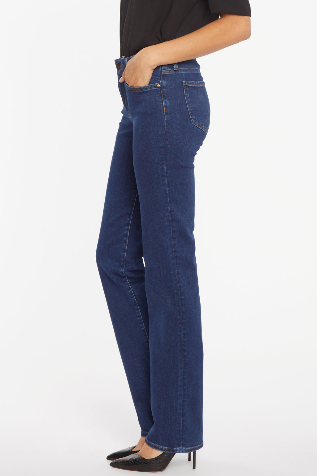 Model wearing NYDJ Marilyn Straight Quinn Jeans 32” dark blue denim styled with black top and heels Shop NYDJ at Dotique