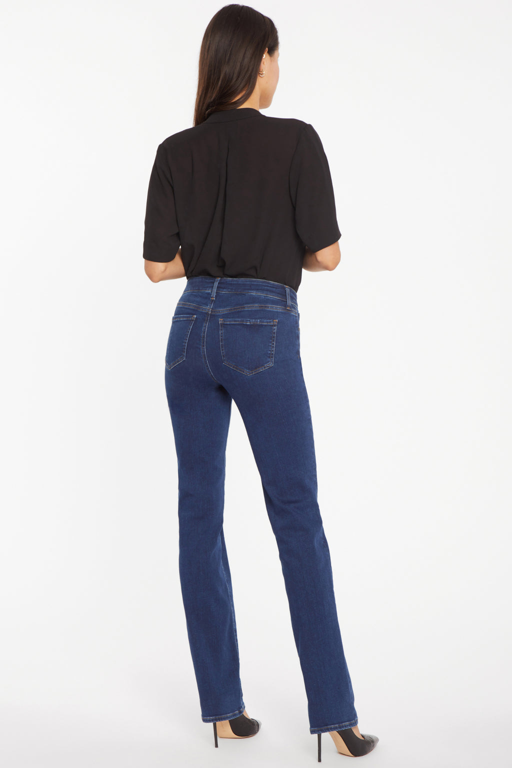 Woman wearing NYDJ Marilyn Straight Quinn Jeans 32” in dark blue by NYDJ, shop the NYDJ collection at Dotique online.