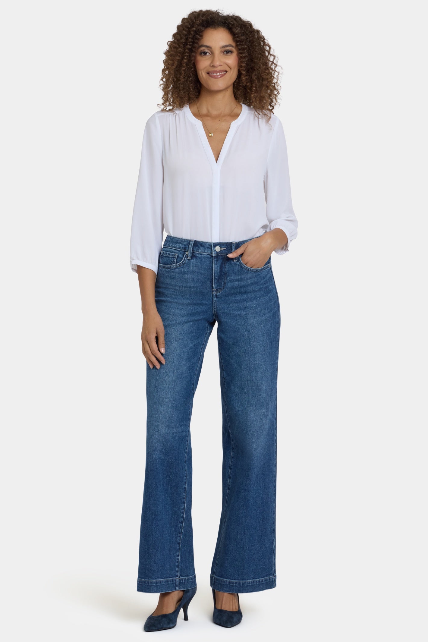 Woman wearing NYDJ Teresa Wide Leg Medium Blue Jeans Lake Notre Dame 33" paired with white blouse, Shop NYDJ at Dotique