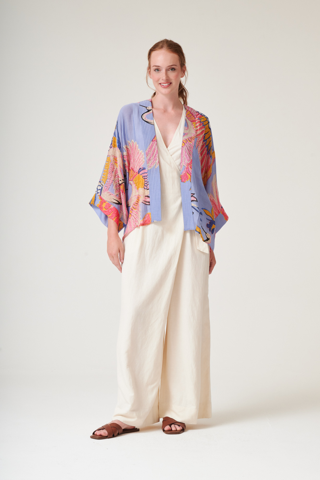 Crane Periwinkle kimono by One Hundred Stars in a premium modal-cupro blend. Lightweight, fluid and perfect for layering over dresses or tops. Shop at Dotique.