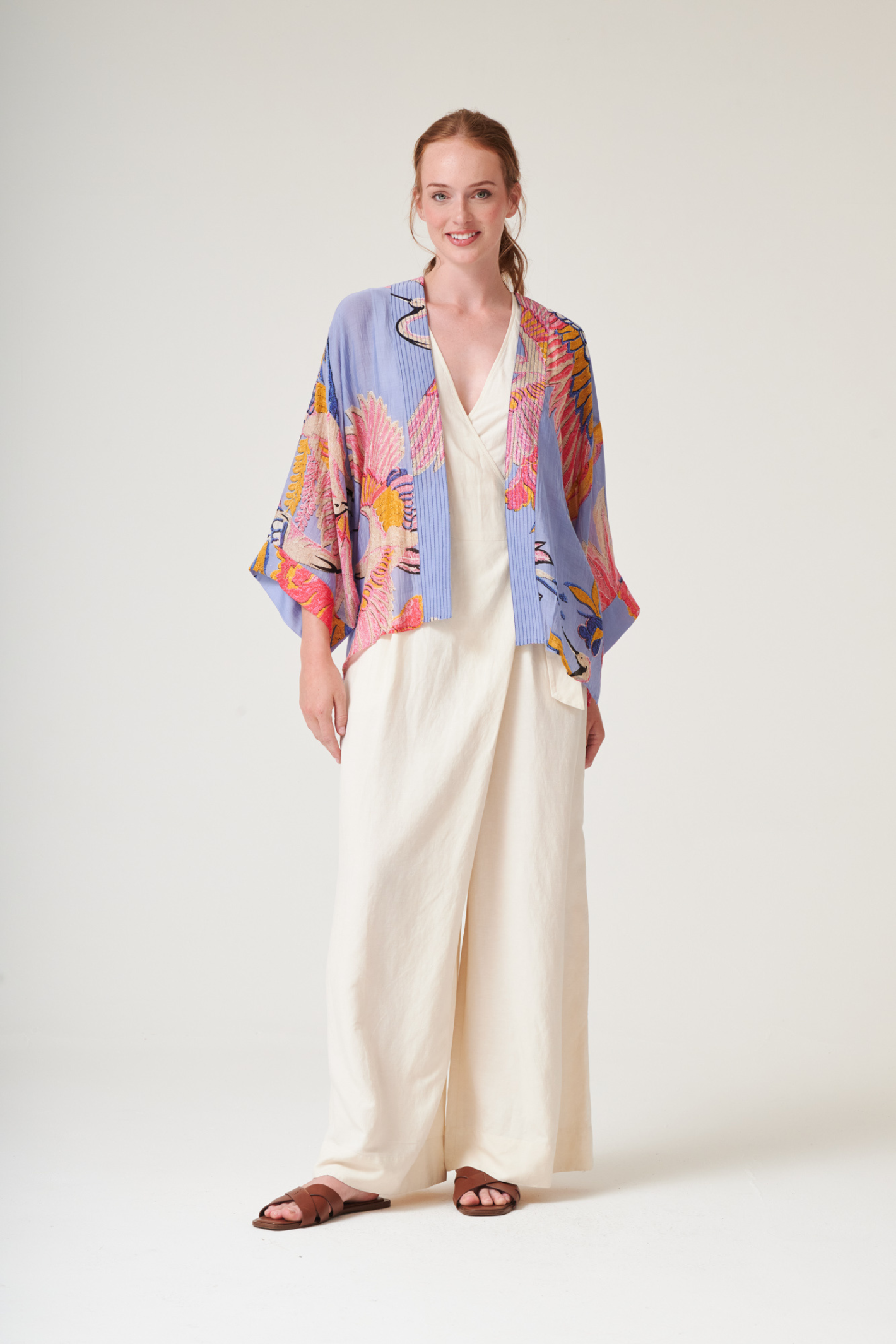 Crane Periwinkle kimono by One Hundred Stars in a premium modal-cupro blend. Lightweight, fluid and perfect for layering over dresses or tops. Shop at Dotique.