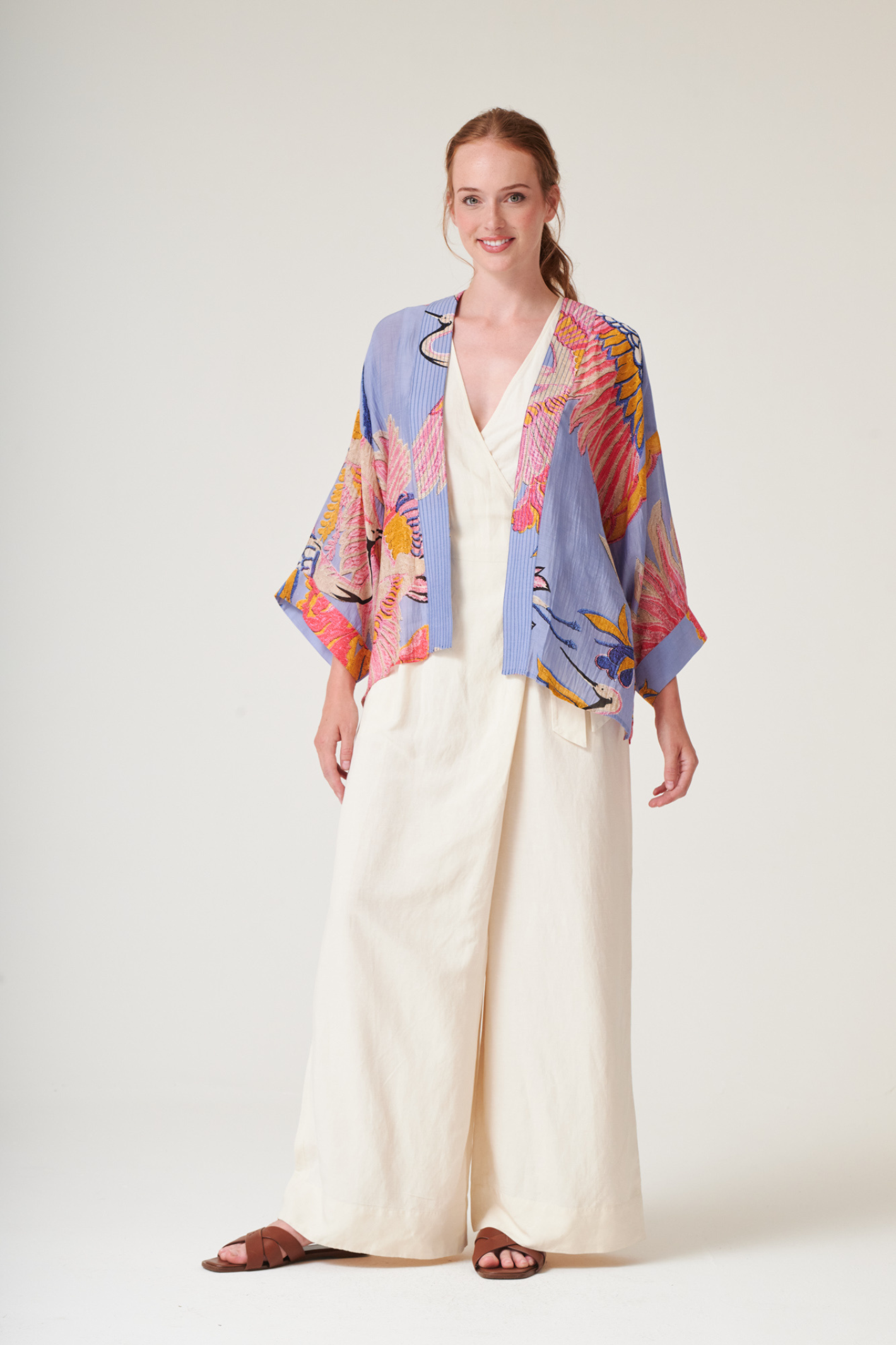 Crane Periwinkle kimono by One Hundred Stars in a premium modal-cupro blend. Lightweight, fluid and perfect for layering over dresses or tops. Shop at Dotique.
