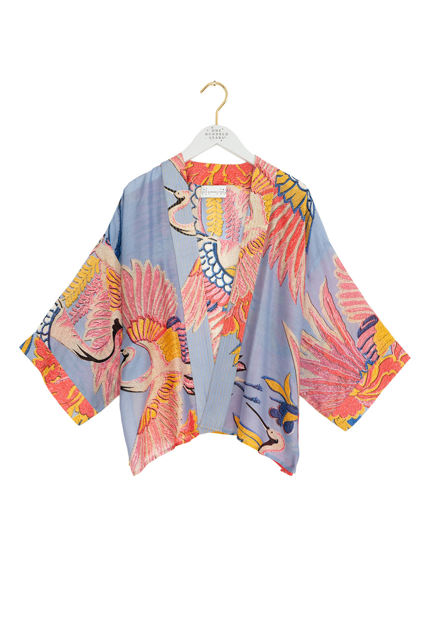 Crane Periwinkle kimono by One Hundred Stars in a premium modal-cupro blend. Lightweight, fluid and perfect for layering over dresses or tops. Shop at Dotique.