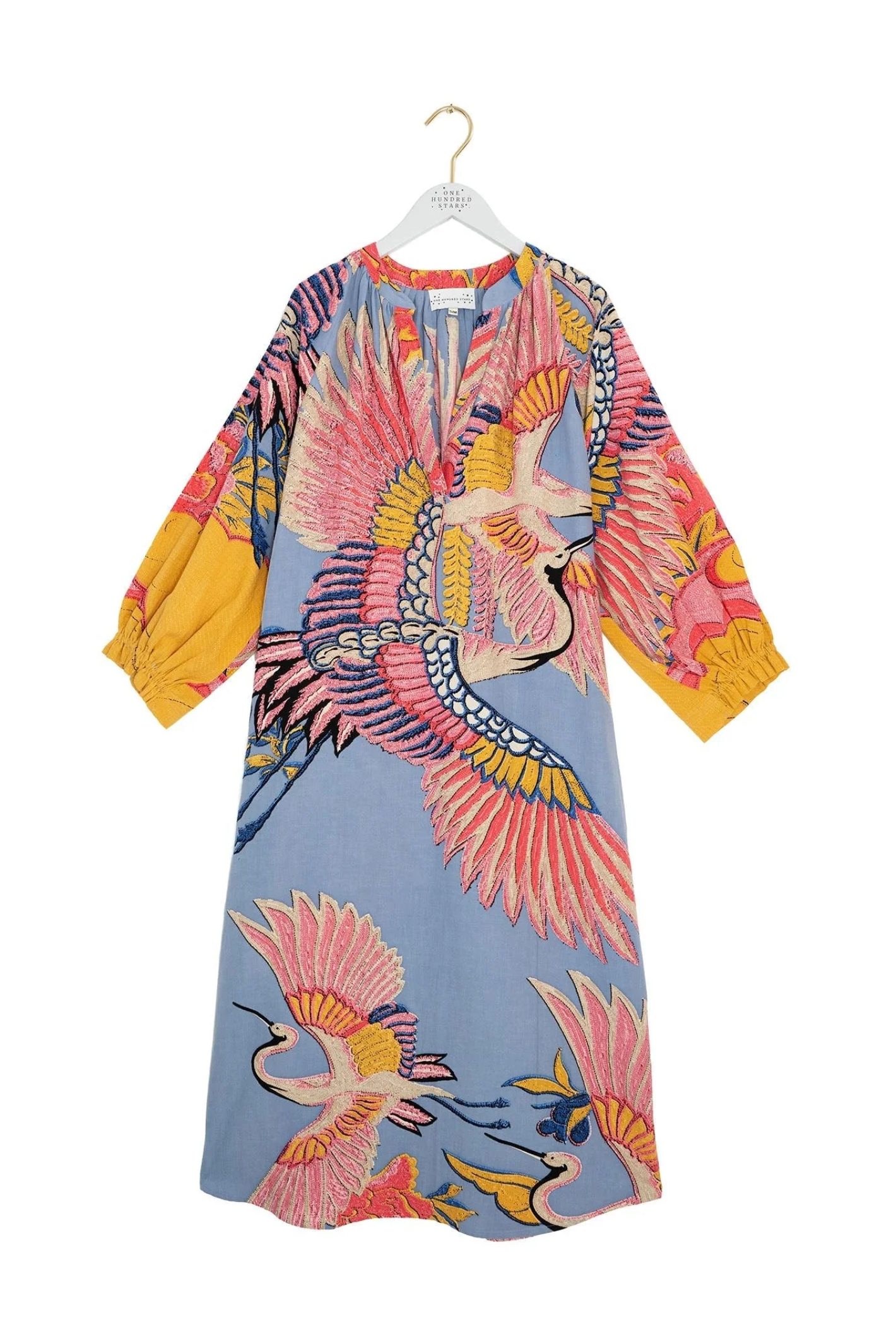 Crane Periwinkle raglan dress by One Hundred Stars with soft print and relaxed silhouette. Made from breathable cotton with side pockets — perfect for summer. Shop at Dotique.