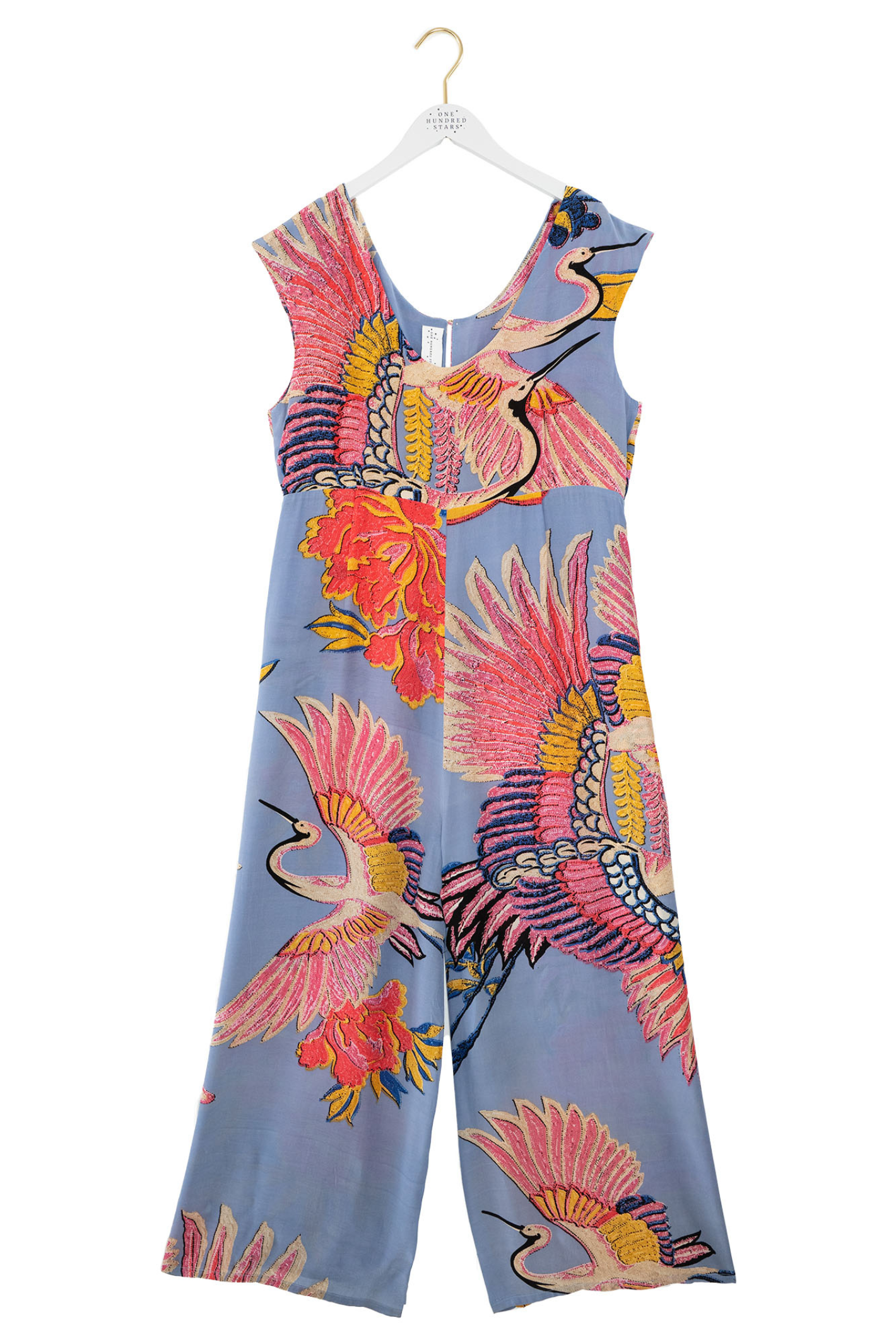 Statement wide-leg jumpsuit by One Hundred Stars in the Crane Periwinkle print. Soft, fluid fabric with a relaxed fit that’s easy to dress up or down. Shop at Dotique.