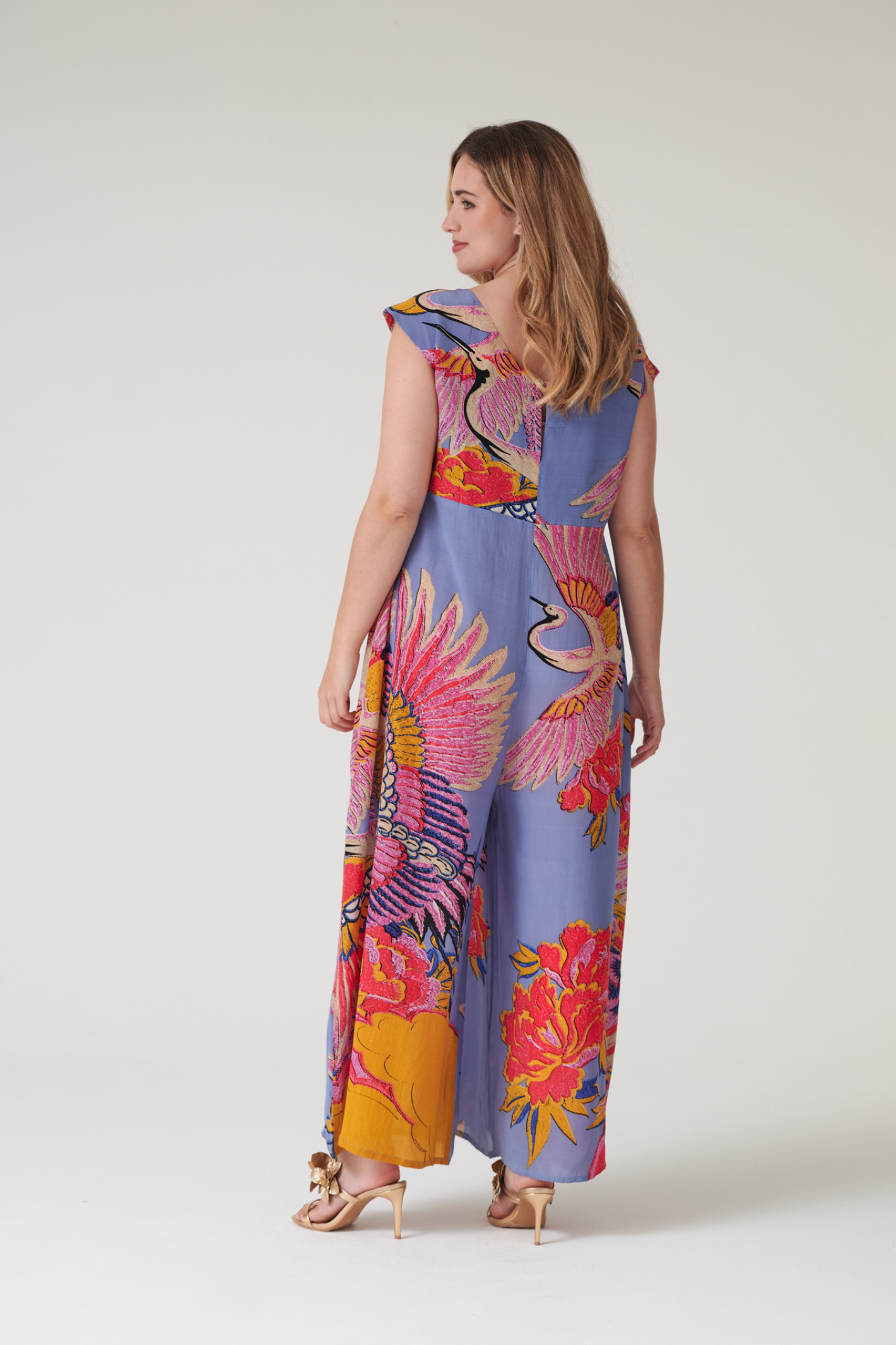 Statement wide-leg jumpsuit by One Hundred Stars in the Crane Periwinkle print. Soft, fluid fabric with a relaxed fit that’s easy to dress up or down. Shop at Dotique.