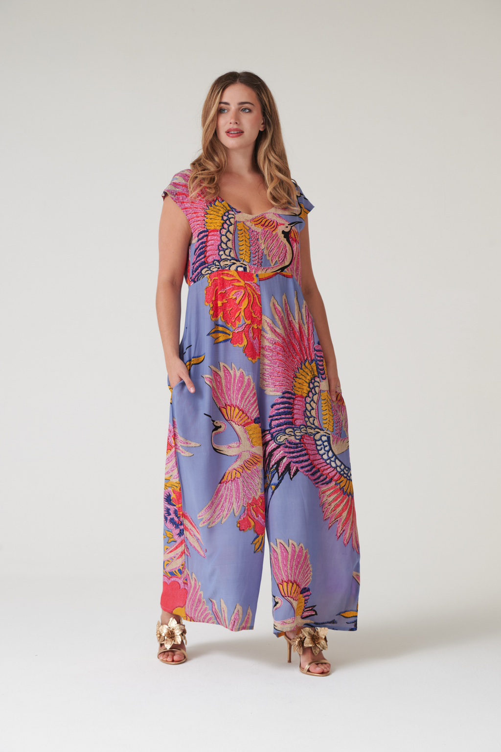 Statement wide-leg jumpsuit by One Hundred Stars in the Crane Periwinkle print. Soft, fluid fabric with a relaxed fit that’s easy to dress up or down. Shop at Dotique.
