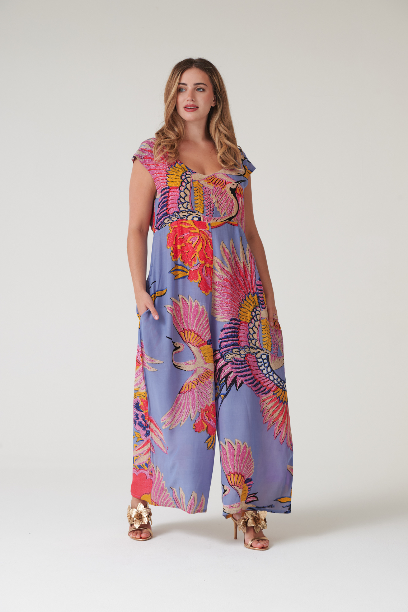 Statement wide-leg jumpsuit by One Hundred Stars in the Crane Periwinkle print. Soft, fluid fabric with a relaxed fit that’s easy to dress up or down. Shop at Dotique.