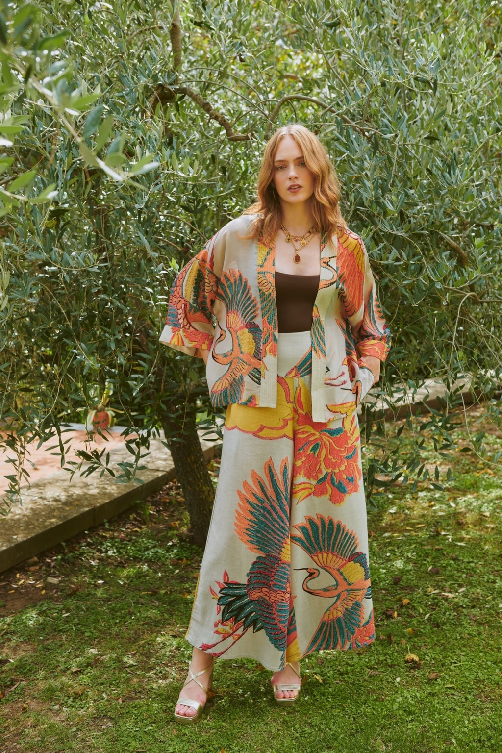 Crane Stone kimono by One Hundred Stars in a premium modal-cupro blend. Lightweight, fluid and perfect for layering over dresses or tops. Shop at Dotique.