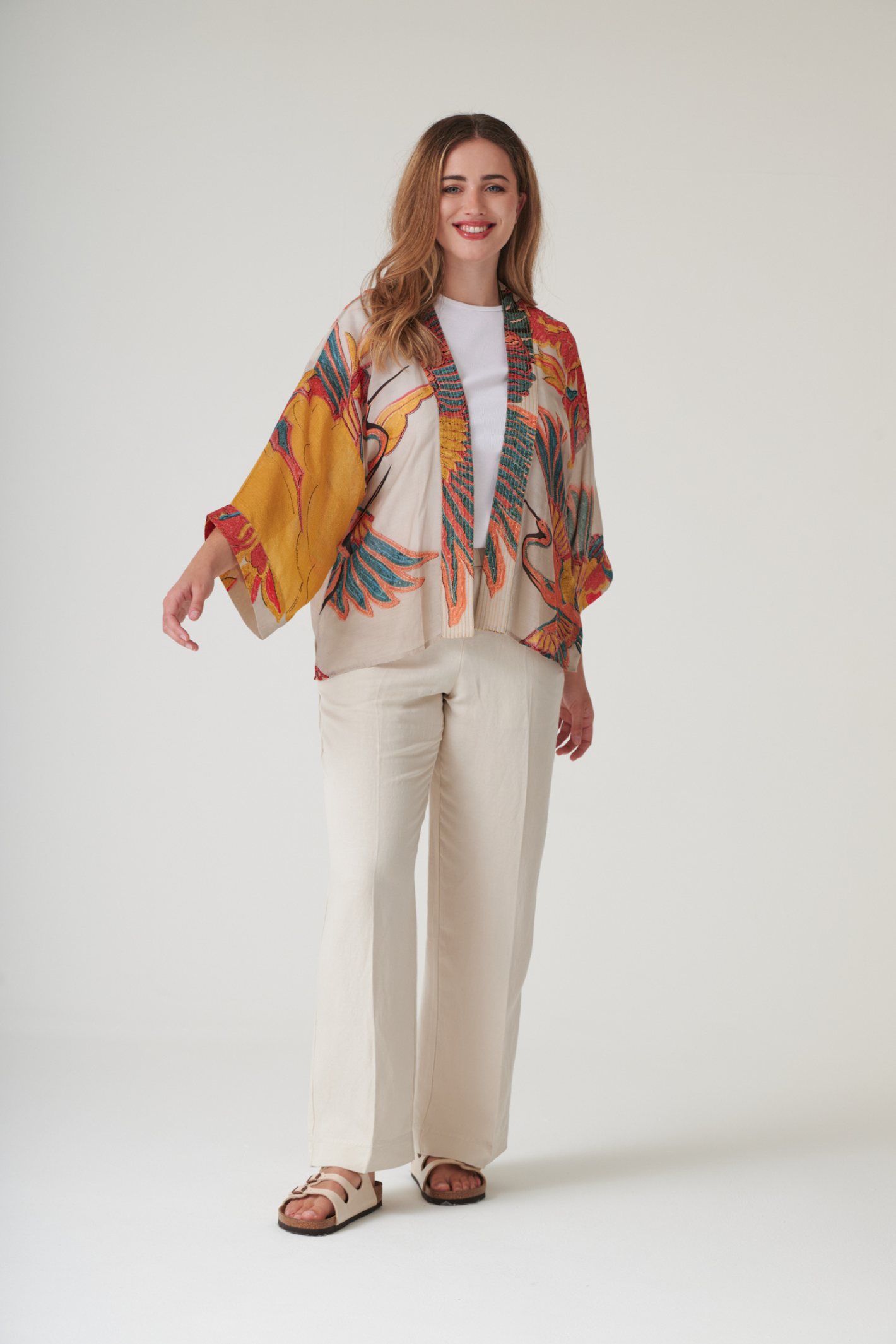 Crane Stone kimono by One Hundred Stars in a premium modal-cupro blend. Lightweight, fluid and perfect for layering over dresses or tops. Shop at Dotique.