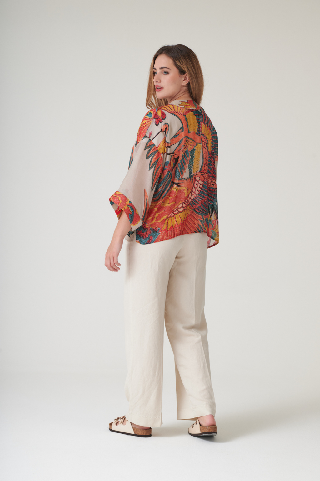 Crane Stone kimono by One Hundred Stars in a premium modal-cupro blend. Lightweight, fluid and perfect for layering over dresses or tops. Shop at Dotique.