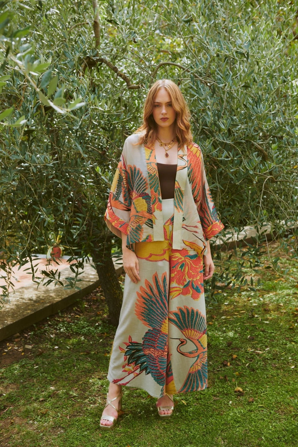 Crane Stone kimono by One Hundred Stars in a premium modal-cupro blend. Lightweight, fluid and perfect for layering over dresses or tops. Shop at Dotique.