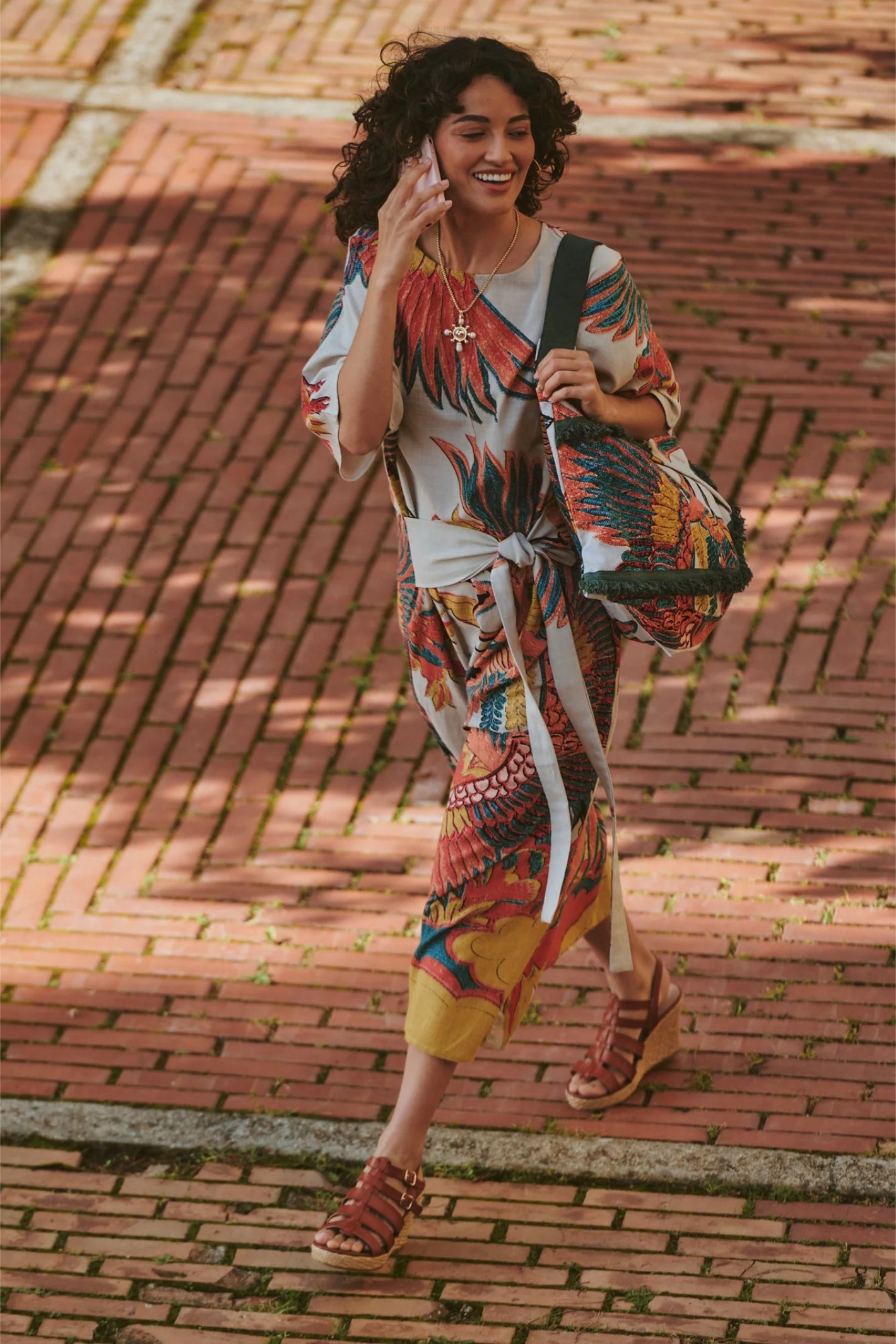 Woman walking outdoors wearing One Hundred Stars DOBCRASTO Crane Stone Obi Dress by One Hundred Stars shop Dotique