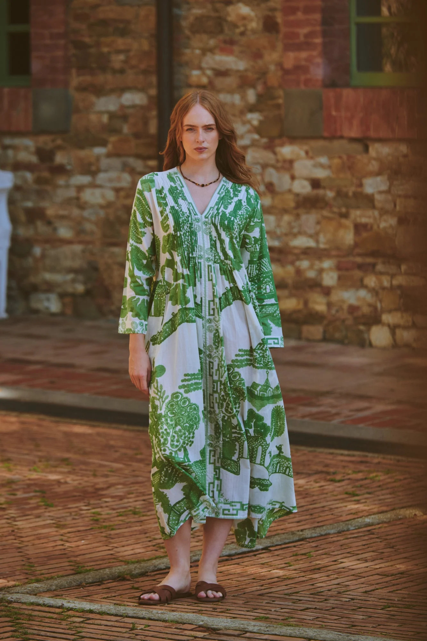 Green Willow maxi dress by One Hundred Stars with pinch pleat detail and pockets. Made from 100% organic cotton, perfect for summer days and warm-weather wardrobes.