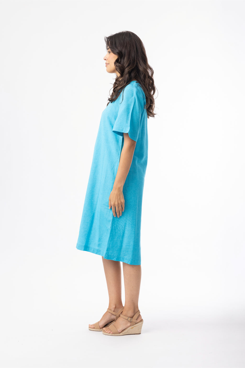 Model side profile wearing Orientique 61766 Linen Essentials Shift Dress Aqua by orientique, shop orientique at Dotique