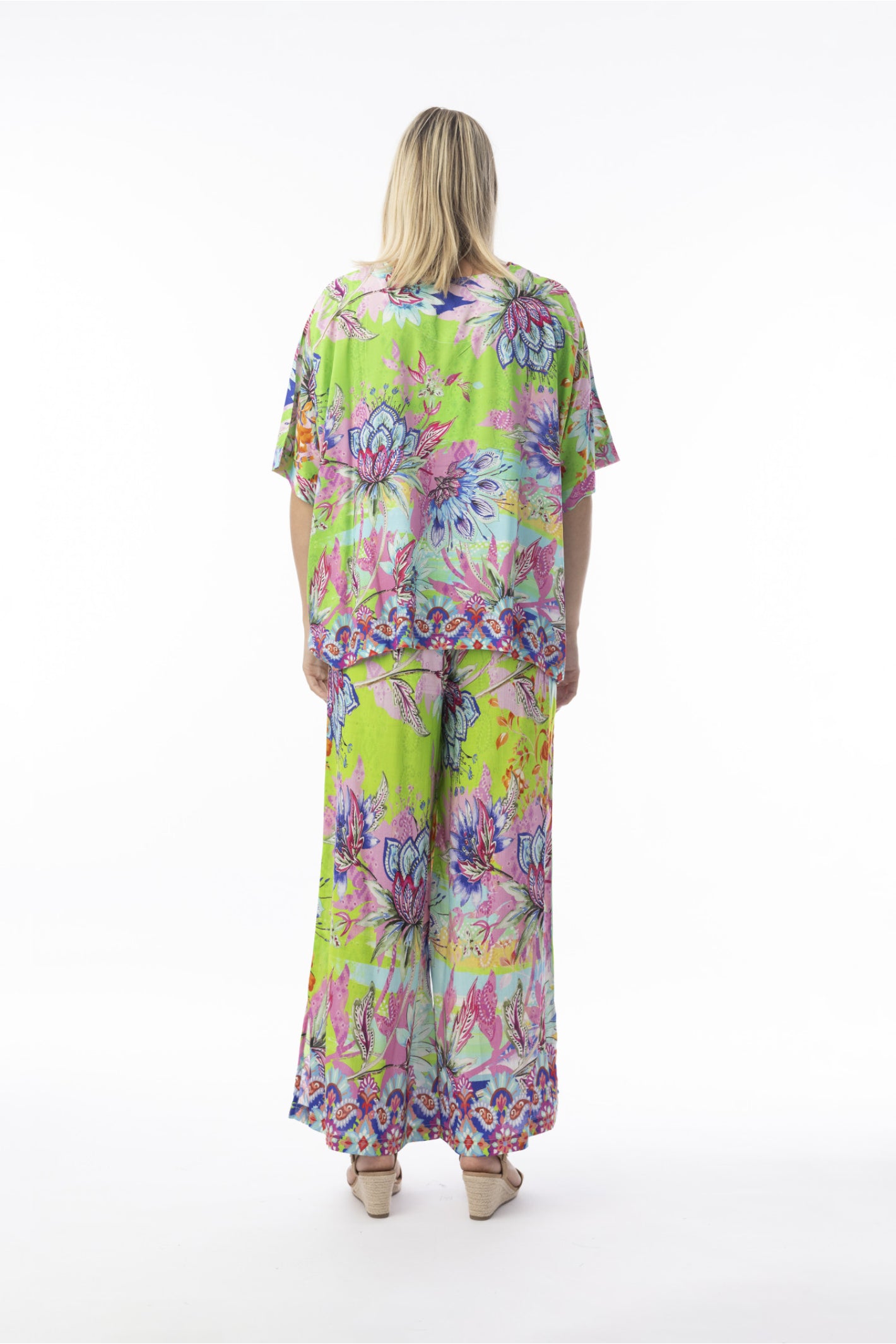 Model rear view wearing Orientique 72567 Digital Top Boxy Floral by orientique, shop orientique at Dotique