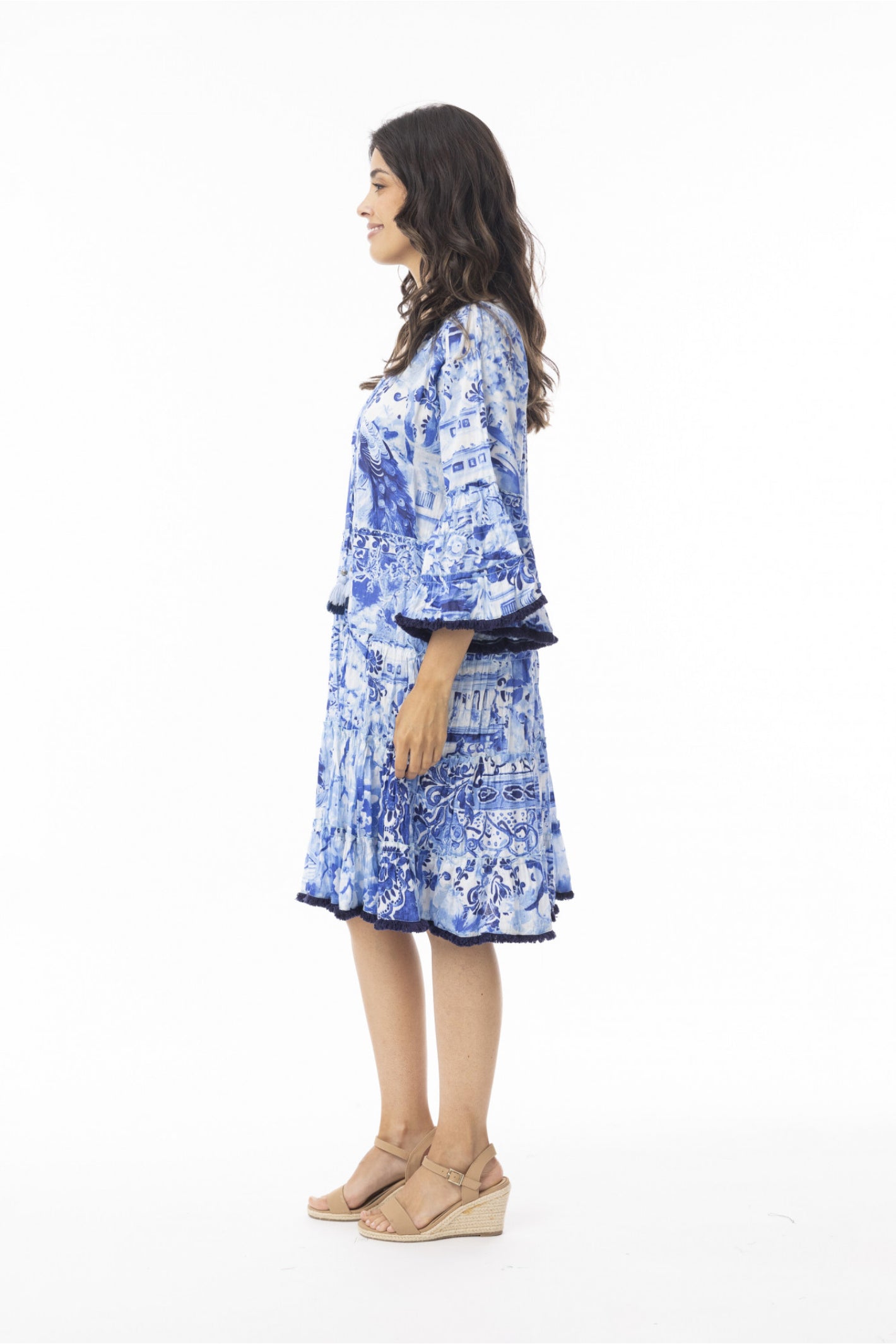 Model side profile wearing Orientique 40188 Okayama Dress Layers Frill Sleeve Print by orientique, shop orientique at Dotique