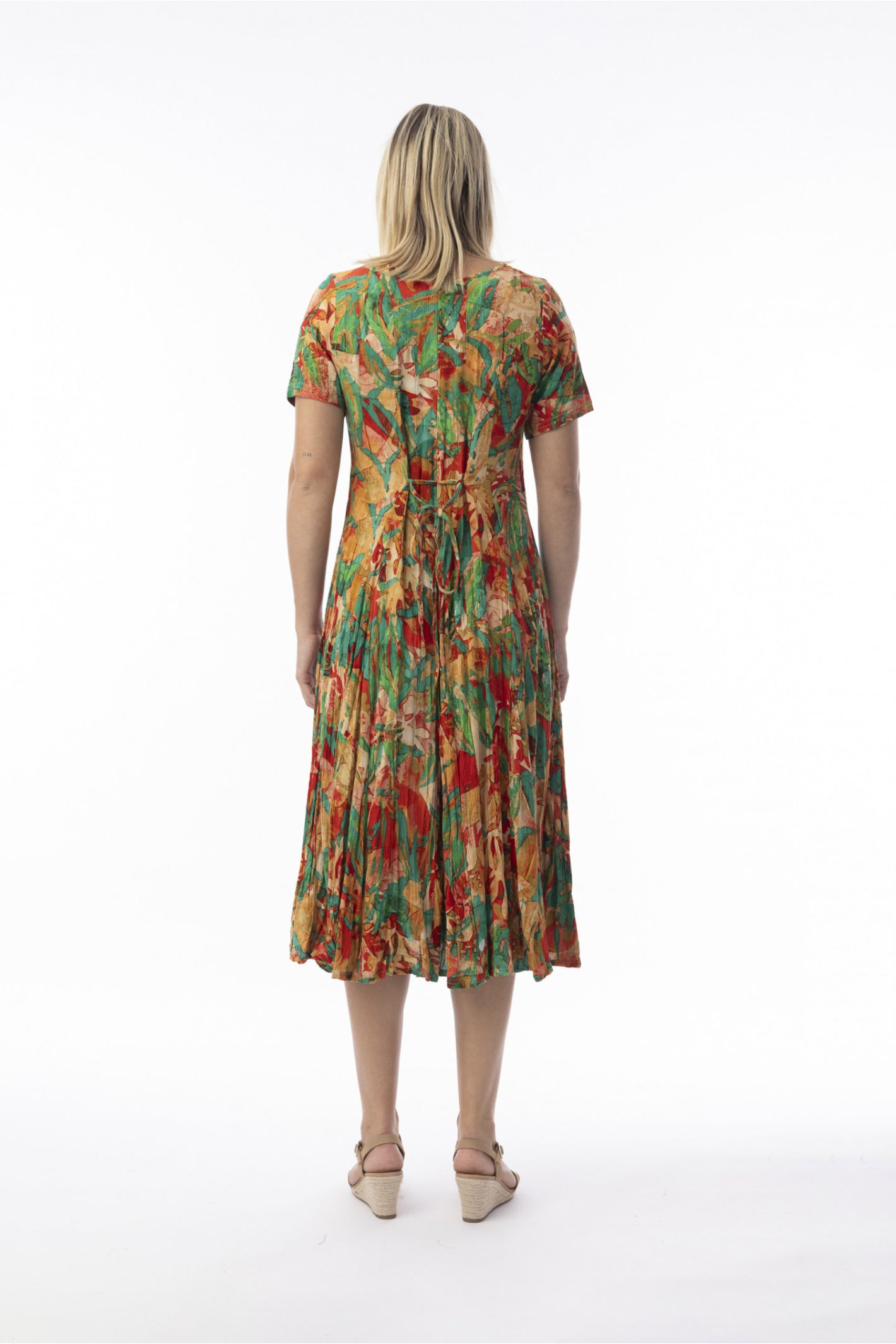 Rear view of model wearing Orientique 30216 Sao Paulo Dress Godet Short Sleeve Print by orientique, shop orientique at Dotique