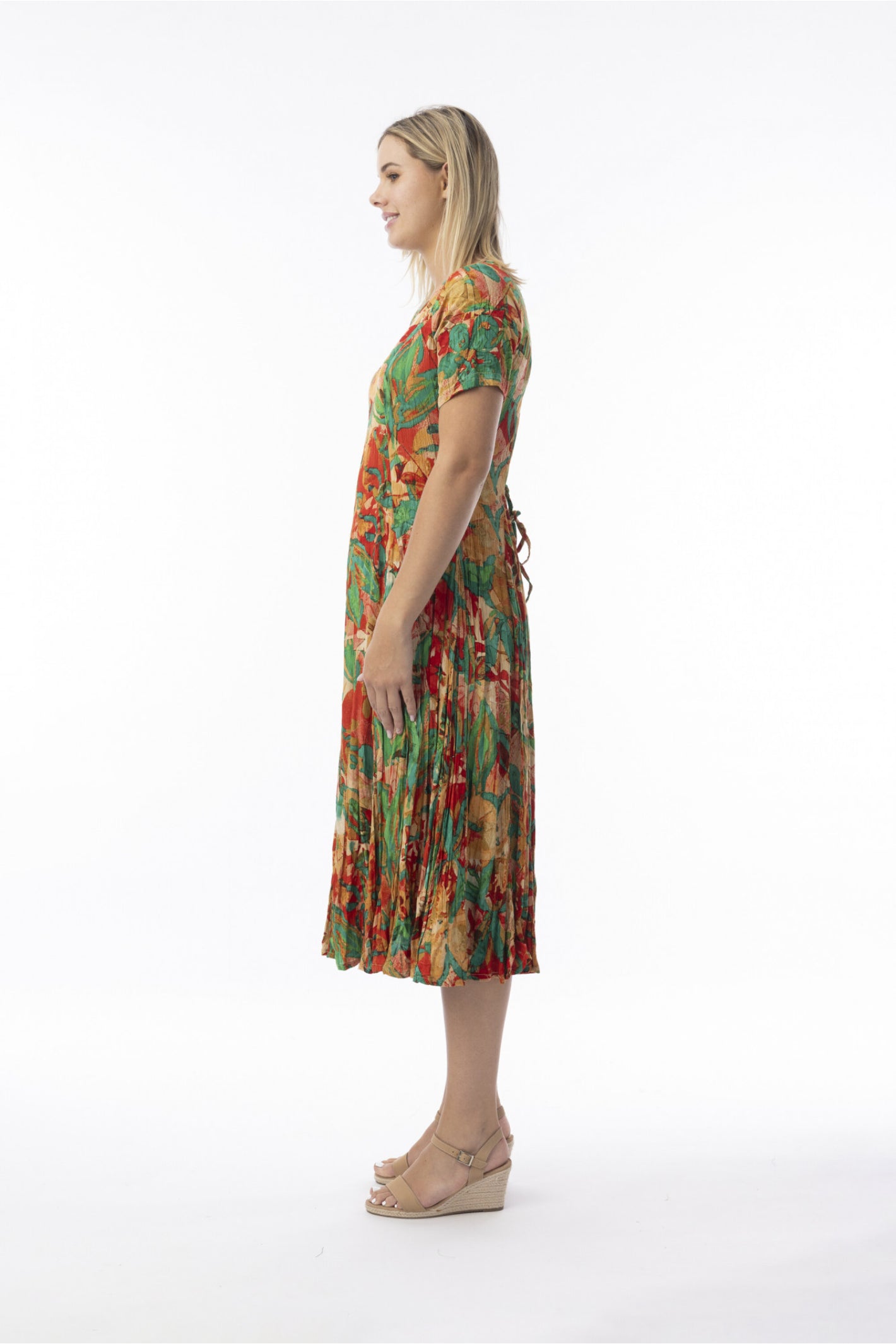 Side view of model wearing Orientique 30216 Sao Paulo Dress Godet Short Sleeve Print by orientique, shop orientique at Dotique