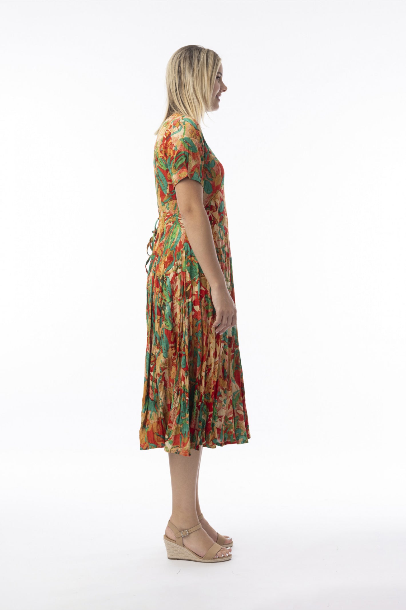 Side profile of model wearing Orientique 30216 Sao Paulo Dress Godet Short Sleeve Print by orientique, shop orientique at Dotique
