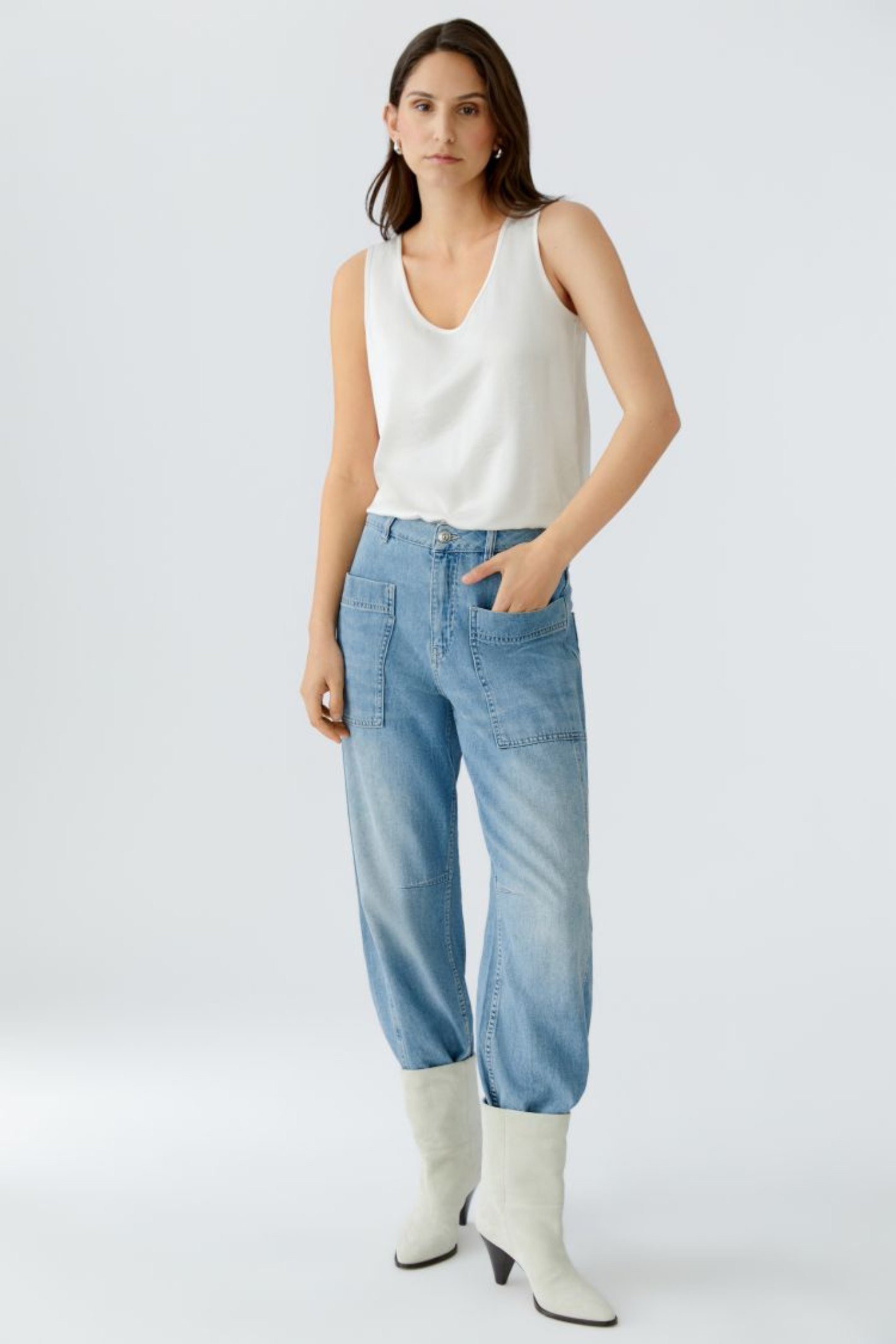 Sleeveless scoop neck top by Oui in soft, fluid fabric. An easy layering essential that works year-round. Available in multiple colours at Dotique.