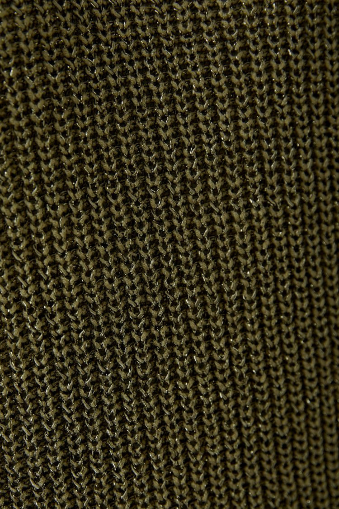 Sleeveless knitted top by Oui in Green Garden. Lightweight with a soft metallic shimmer and flattering V-neck. Easy to layer or wear alone. Shop at Dotique.