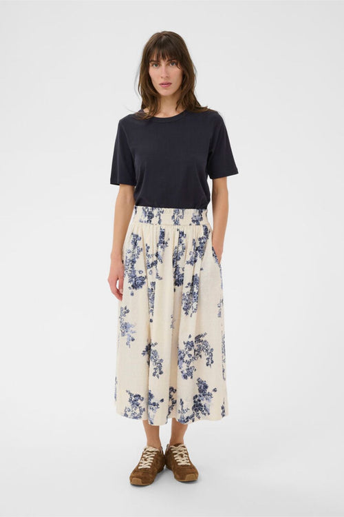 Woman wearing Part Two 30310449 AmaiaPW Blue Shadow Flower Print Skirt by Part Two, shop Part Two at Dotique.