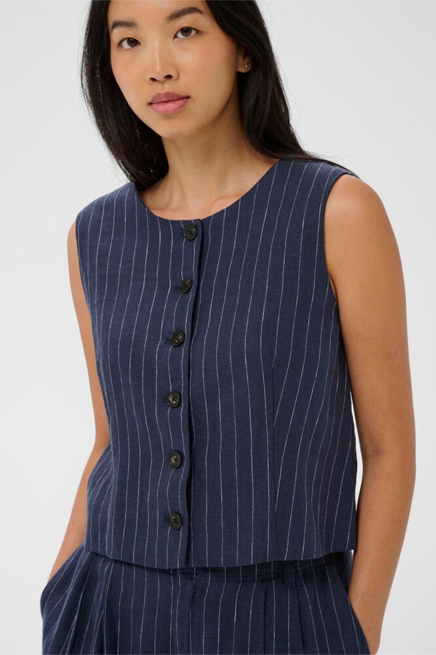 Woman wearing a navy pinstripe waistcoat with buttons, Part Two 30310487 AzaniaPW Blue Nights Pinstripe Waistcoat by Part Two, shop Part Two at Dotique