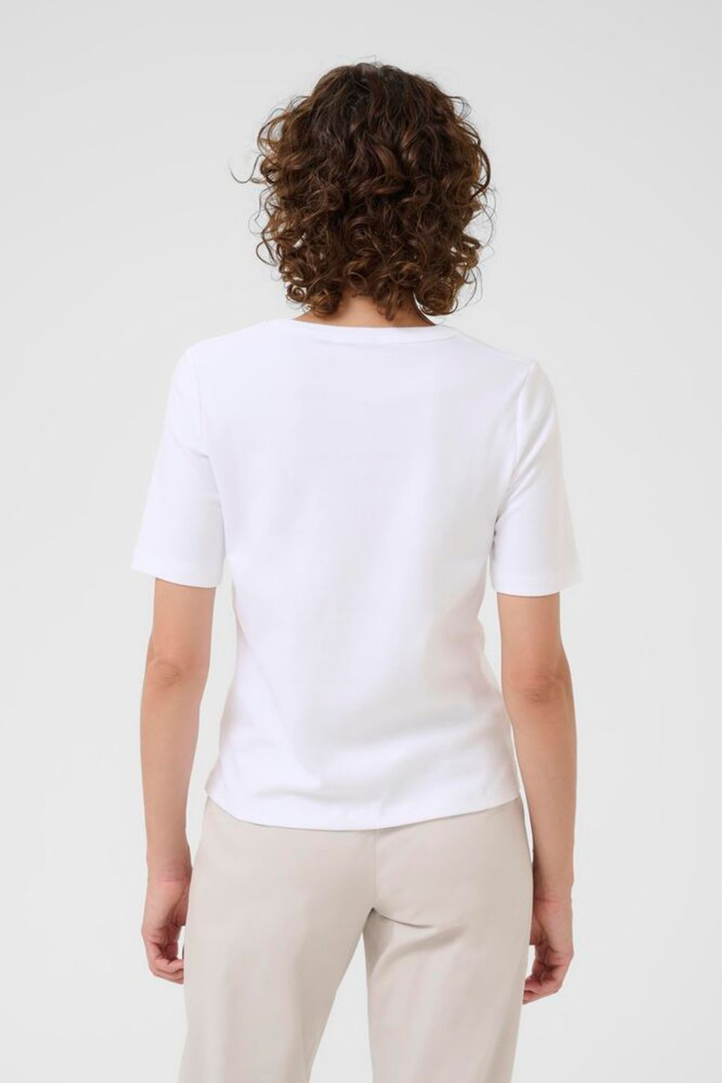 White V-neck T-shirt by Part Two made from 100% organic cotton. A timeless wardrobe staple that’s easy to style with jeans or tailoring. Dotique.