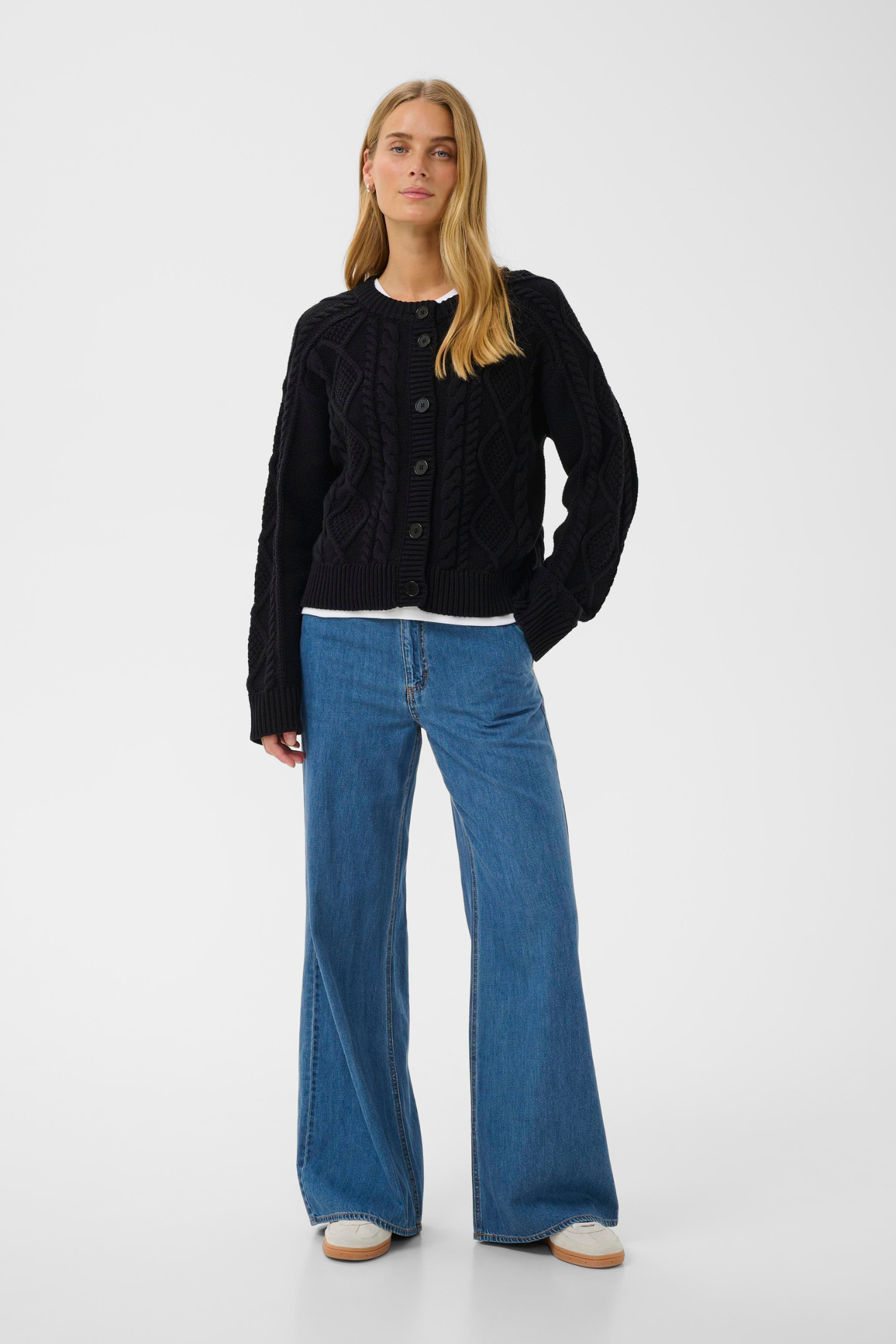 Dark navy cable knit cardigan by Part Two with button front. Soft, easy to wear and perfect for everyday layering.
