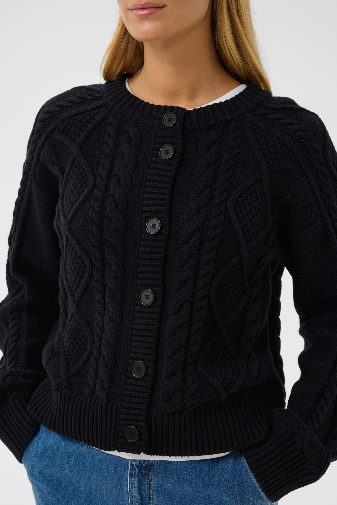 Dark navy cable knit cardigan by Part Two with button front. Soft, easy to wear and perfect for everyday layering.