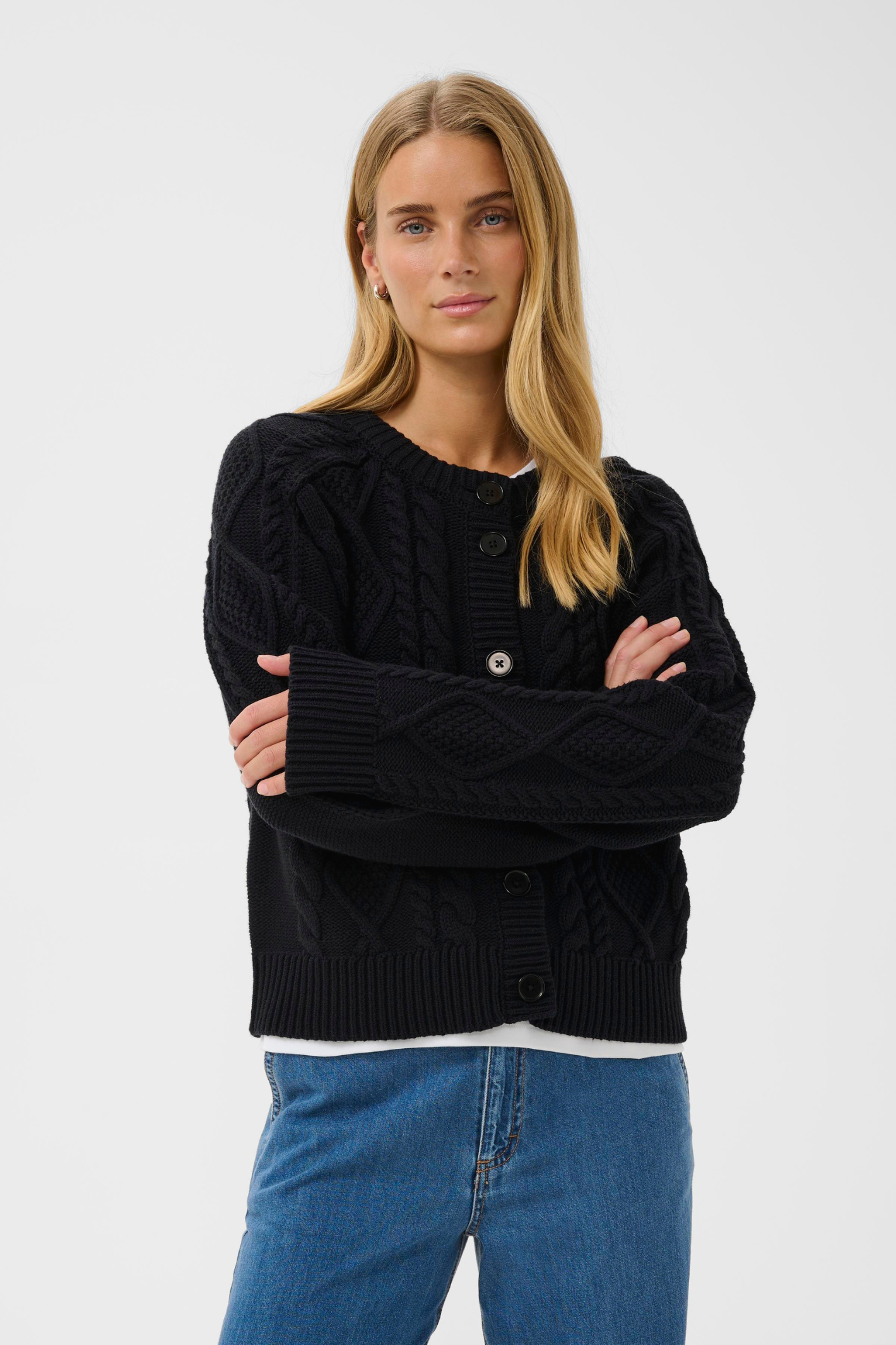 Dark navy cable knit cardigan by Part Two with button front. Soft, easy to wear and perfect for everyday layering.