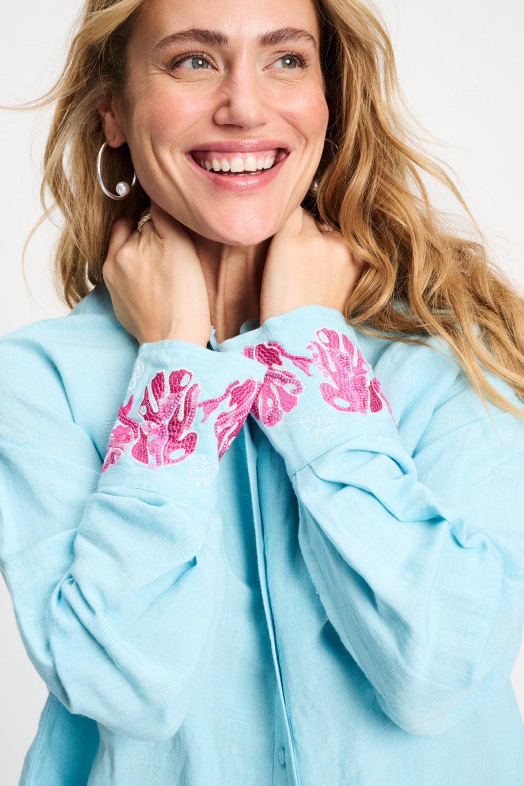 Woman smiling wearing Pom Amsterdam SP9499 Amsterdam Blue Sequins Urban Flora Blouse by Pom Amsterdam shop Dotique
