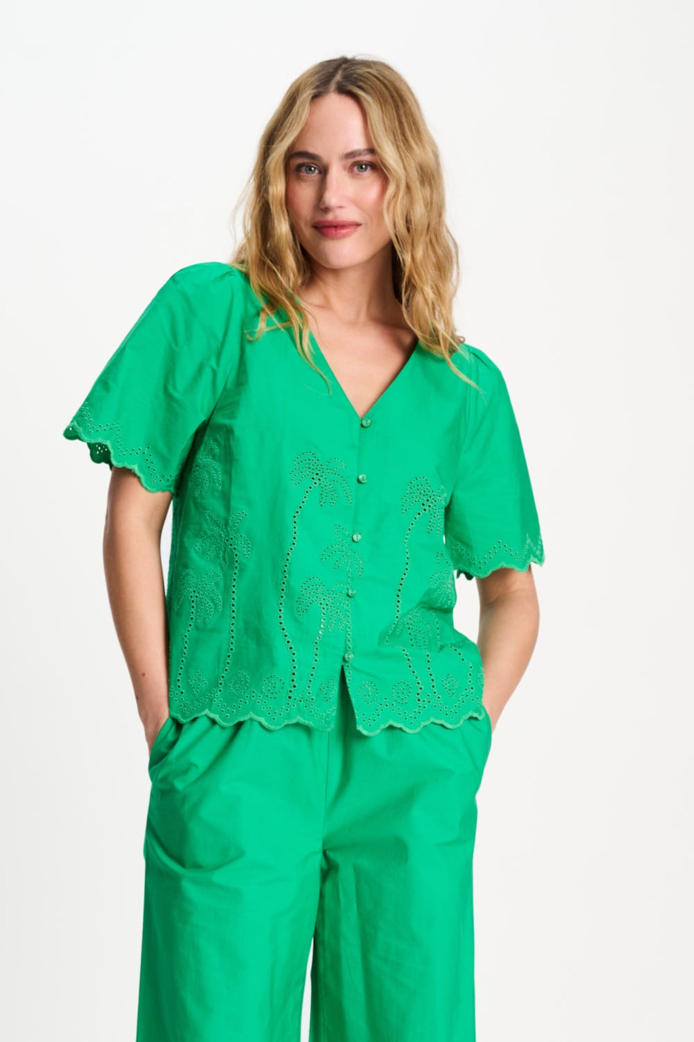 Woman wearing Pom Amsterdam SP9544 Broderie Anglaise Palm Green Organic Cotton Blouse by Pom Amsterdam shop Dotique