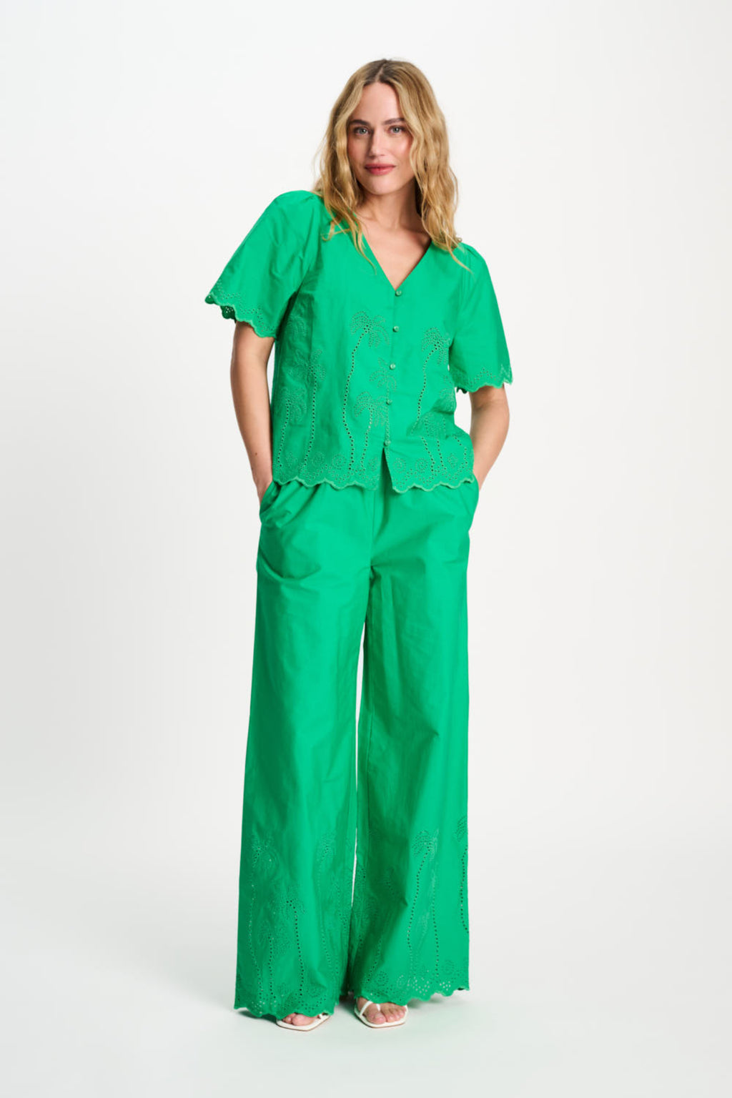 Woman wears Pom Amsterdam SP9544 Broderie Anglaise Palm Green Organic Cotton Blouse by Pom Amsterdam, shop Pom Amsterdam at Dotique