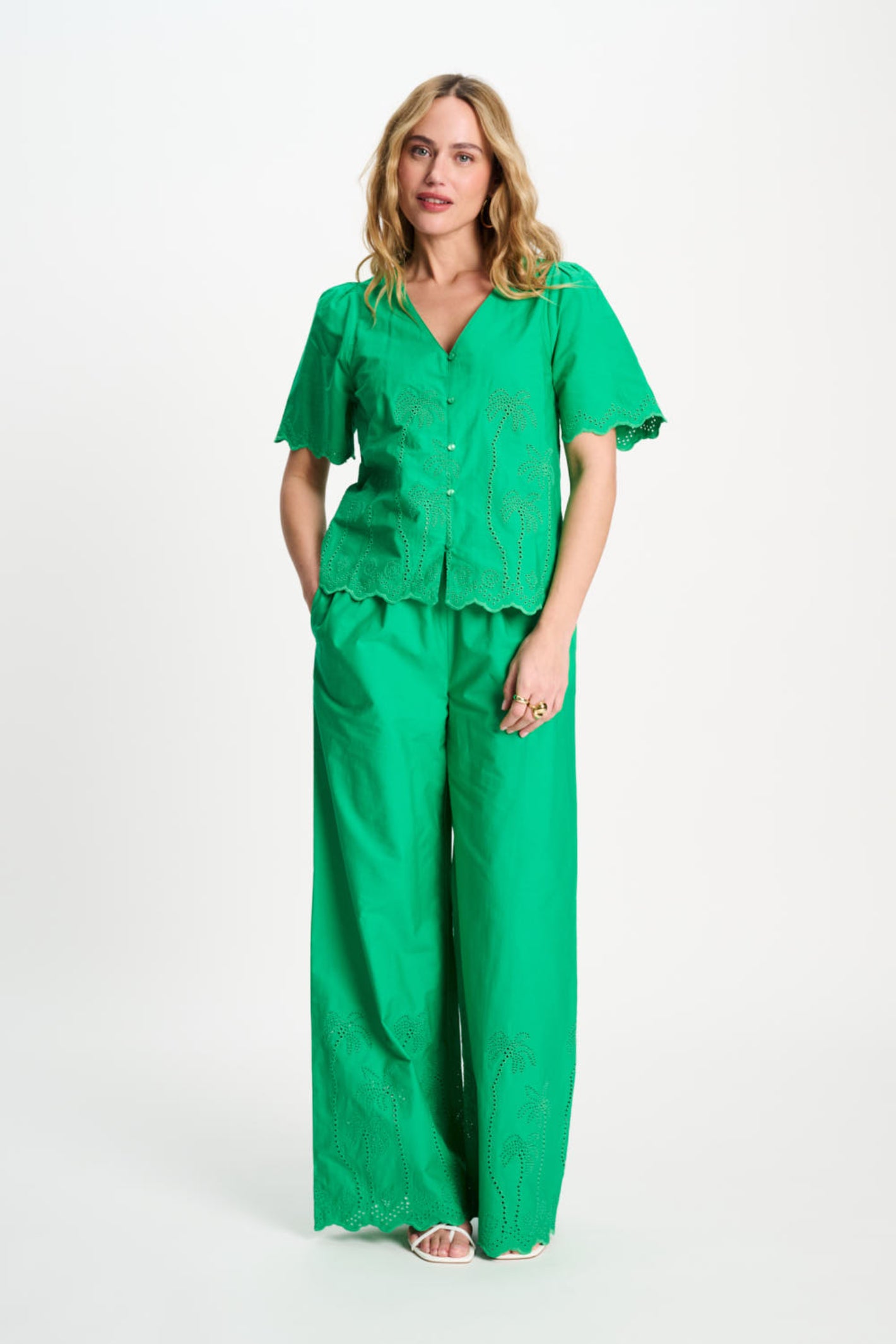 Woman models Pom Amsterdam SP9544 Broderie Anglaise Palm Green Organic Cotton Blouse by Pom Amsterdam shop Dotique